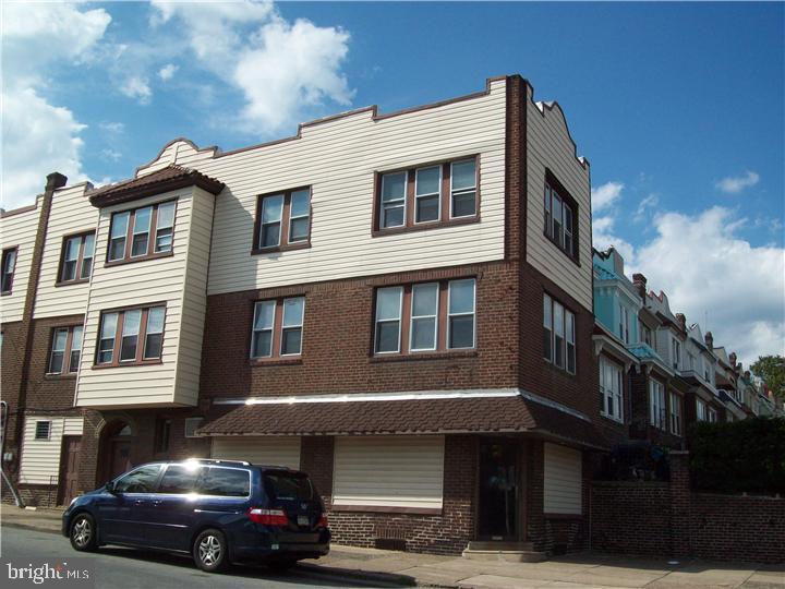 A large mix-use building, first floor front office space, middle room office, 1 car garage and a 2 car garage. Second and third floors are 2 bedroom apartment, with Living Rooms Dining Rooms and brealfast room with eat-in Kitchen. There is a deck over the 2 car garage. Fire alarm system, high efficiency heaters, fresh concrete basement floor. Property has been maintained, though could use cosmetic upgades.
