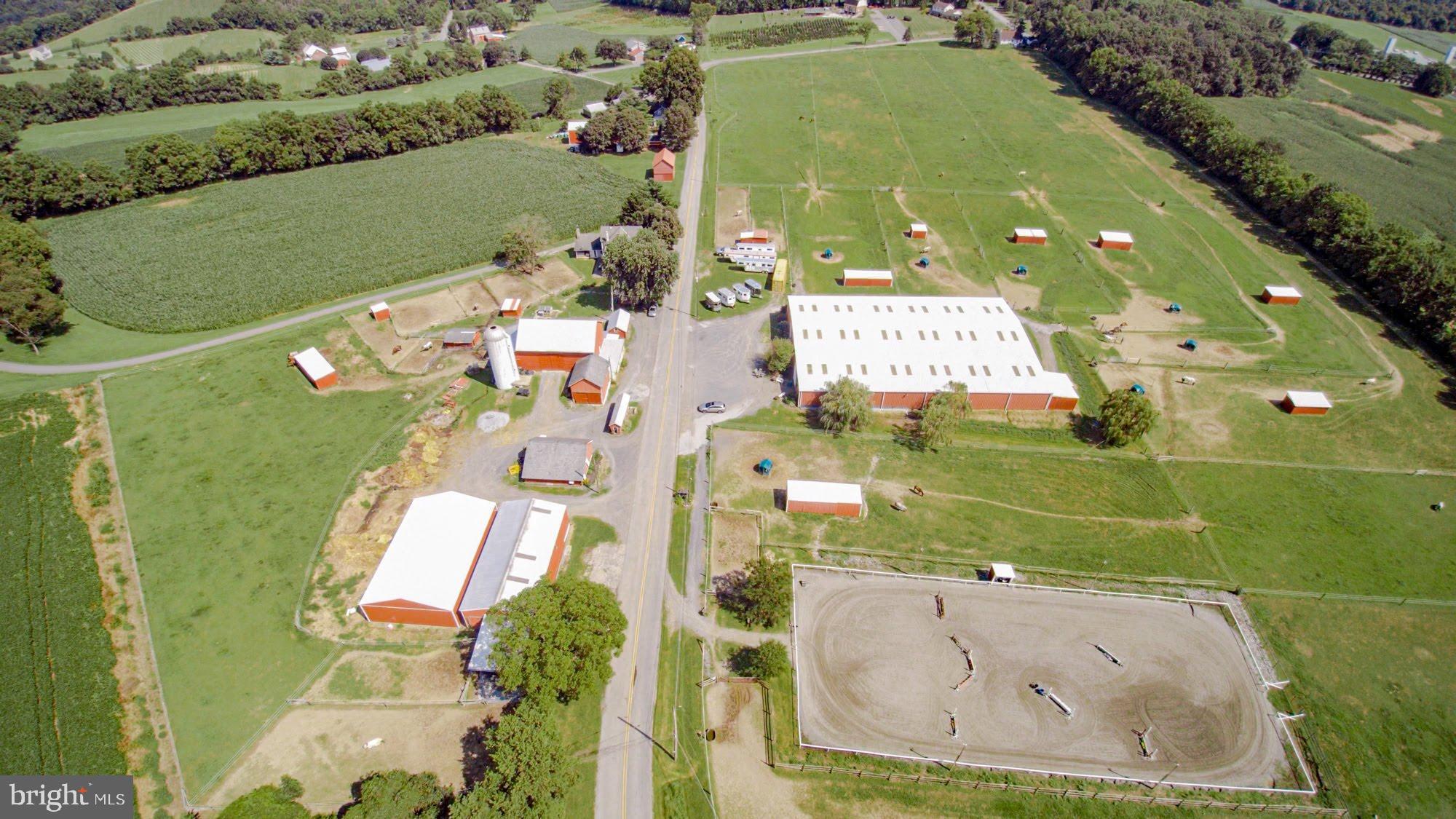 Income-producing horse farm  on quiet country road yet in the super convenient location of coveted Forks Township .  Low taxes! 55 stalls, indoor & outdoor rings, cute farm house with attached apartment on 22+ flat acres which are mainly covered in pasture with poly coated high tensile electric. Eat-in kitchen with double sink and tile floors, formal dining room, sitting area, living room with stone fireplace, full bath, mud room and laundry with 1/2 bath on the first floor. Second floor master bedroom with full bathroom and separate living room/office. Two additional bedrooms all on the second floor. Attached first floor apartment with kitchen, bedroom, 3/4 bathroom, living room with wood stove and separate electric meter. Main building 105x150 with 60x150 sand and rubber footing arena with overhead sprinkler system, newer kickboard and heated viewing room (windows need to be replaced).  26 10x12 matted stalls, heated tack room, hot & cold wash stall, grain prep station, heated room for hot water tank and pressure well pump tank also for hose storage, additional tack room for lesson tack and storage area for straw or hay. Large lighted outdoor sand arena 80x200 with trainers shed. 40x60 pole barn with 10 10x12 matted stalls and tack room plus storage area for straw or hay. 40x60 pole building currently being used as equipment storage. Small barn with 4 10x12 matted stalls and tack room. Large bank barn with hay and straw storage upper level, 6 10x12 matted stalls inside, 5 small pony stalls outside and 4 additional 10x12 matted stalls. Plus a large 20x24 room for bag shavings and grain storage. Front hay storage area for daily access. Small barn with 2 10x10 matted stalls.  9 large pastures .cWide maintained riding path around the entire property +/- 1 mile. 10 paddocks for individual turnout and/or layups with run-in sheds. Horse trailer area for six 2 horse trailers and three large goose neck trailers. Property has two wells one for the main barn and one for the house and other buildings. Also 8 frost free outdoor faucets & 3 frost free faucets in the main barn facilitate watering. One hot one cold water. Located just 5 miles from NJ, 2 miles from 611, 5 minutes from 33, 22, close to I 78 close to town with McDonald s, Giant supermarkets, Weis supermarkets, 2 gyms, restaurants, Large Pharmacies, multiple banks, Ace hardware and much more. 10-15 minutes with from Walmart, Wegmans,  Sams Club, Kohl s, many restaurants, movie theater, local Mall plus much more. List of equipment & farm items available.  PIN # H9 12 3 0311 included.  Proof of funds required. Seller & broker make no claim or guarantee as to how many horses are permitted on property, buyers should check w/ zoning.
