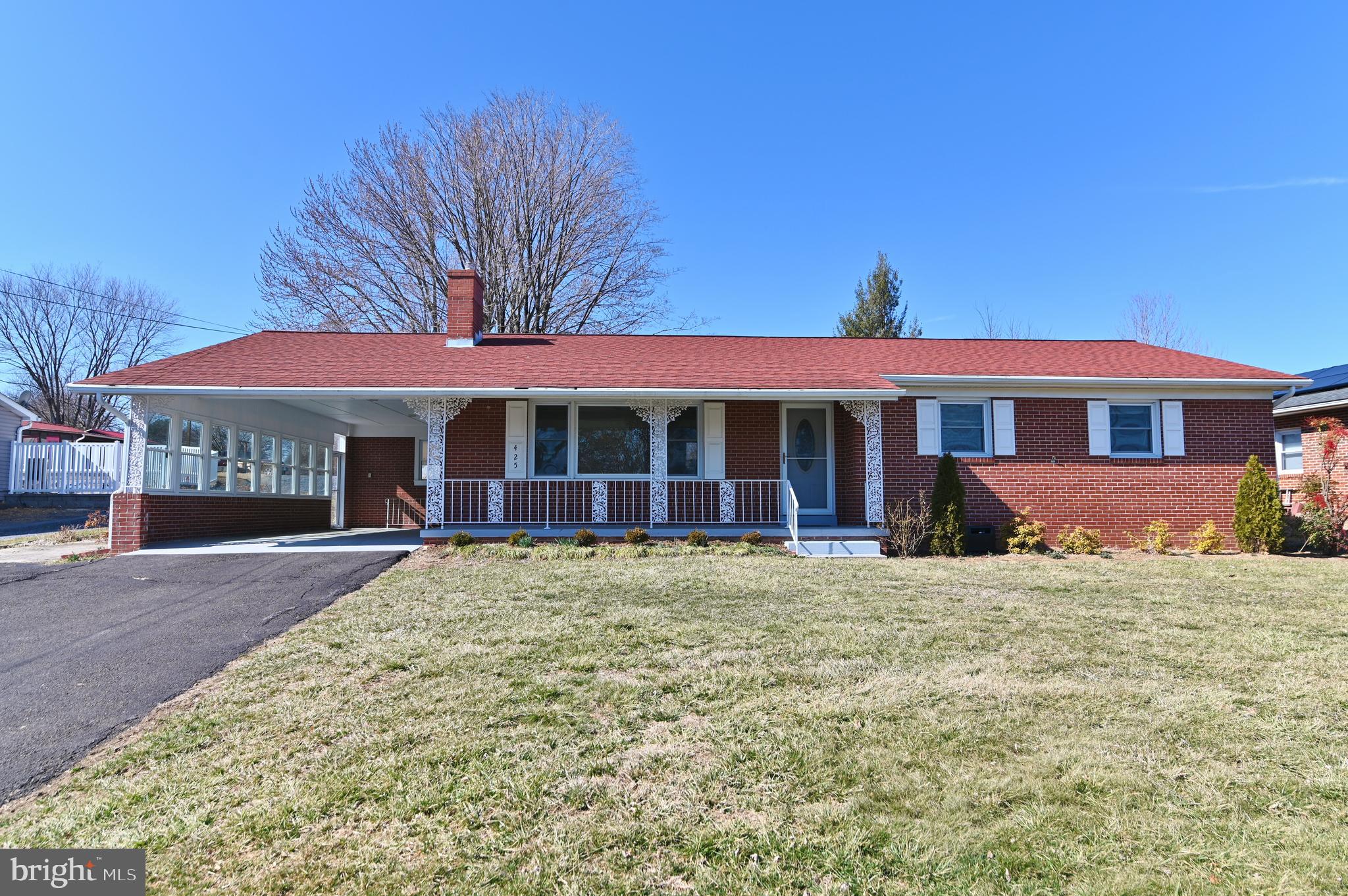 Spectacular views of Massanutten Mountain!  This all brick rancher on the skirts of town offers pasture like setting with all the conveniences of in-town living.  This beautifully maintained home features 3  bedrooms and 2 bathrooms on a large .60 acre lot with outbuilding.  The home has a new architectural shingle roof, paved driveway and porches for outdoor living.  The main level boasts an upgraded kitchen with beautiful black countertops.  The kitchen flows into the dining area for perfect meals and gatherings.  The spacious living room provides a comfortable area for relaxation, entertainment, a cozy gas fireplace and magnificent picture window to enjoy the outdoor view.  The newly refinished hardwood floors are gorgeous, upgraded bathroom with designer tile and large walk-in shower are stunning.  Full basement offers additional living space, full bath and versatility for a rec room, crafts, and more.  Schedule your private tour today and make this charming brick rancher located at 425 N. Lee Street, Woodstock, VA your new home!