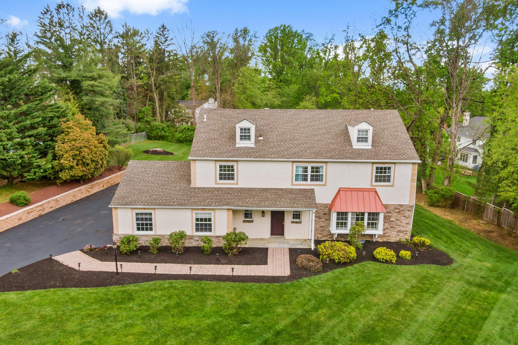 Nestled on a sprawling 1.2-acre lot, 3503 St. Davids Road offers the rare combination of privacy and modern functionality as well as a flexible floor plan designed to adapt to your unique lifestyle—whether you need a dedicated home office, a guest suite, or creative hobby spaces. As you arrive at the property, you are immediately struck by the serene setting and beautiful landscape which serves as a perfect backdrop for the house. Entering the front door you immediately notice the beautiful hardwood flooring and abundance of natural light flowing through the home. The spacious living/entertaining room on the right features a large window which offers a fabulous view of the beautiful front yard landscape. The living room flows seamlessly into the spacious dining room and onto the updated kitchen complete with a center island, pendant and recessed lighting, custom backsplash, stainless steel appliances and quaint brick accent wall. Continue on into the family room anchored with a charming brick fireplace and large windows which provide a perfect view of the expansive back yard. Sliding doors from the kitchen lead to a large maintenance-free deck which opens to the private rear yard, making this a perfect area for relaxing, entertaining, or enjoying various outdoor activities. The main level is completed by a convenient half bath , laundry room and access to the two-car garage with new epoxy flooring. The second floor opens to a large Primary Bedroom with an updated ensuite bathroom, plus a private deck which overlooks the lovely back yard.... perfect for relaxing and enjoying evening sunsets. Three additional bedrooms and a full updated bathroom in the hall complete this level. The 3rd level features a private suite which includes a bedroom, full bath, storage and additional flex living space. The large finished basement with recessed lighting offers many options to fill all your additional living space needs. This home is conveniently located close to parks, biking/walking trails, restaurants and more. Just minutes to downtown Wayne and enjoy easy commuting via Routes 202, 252, West Chester Pike, and Lancaster Avenue, or the St. Davids or Wayne Train Stations. If golfing is your passion, this home is across the street from the world class Aronimink Golf Club! This is a fabulous, well maintained home in a highly desirable community. Schedule your appointment today!