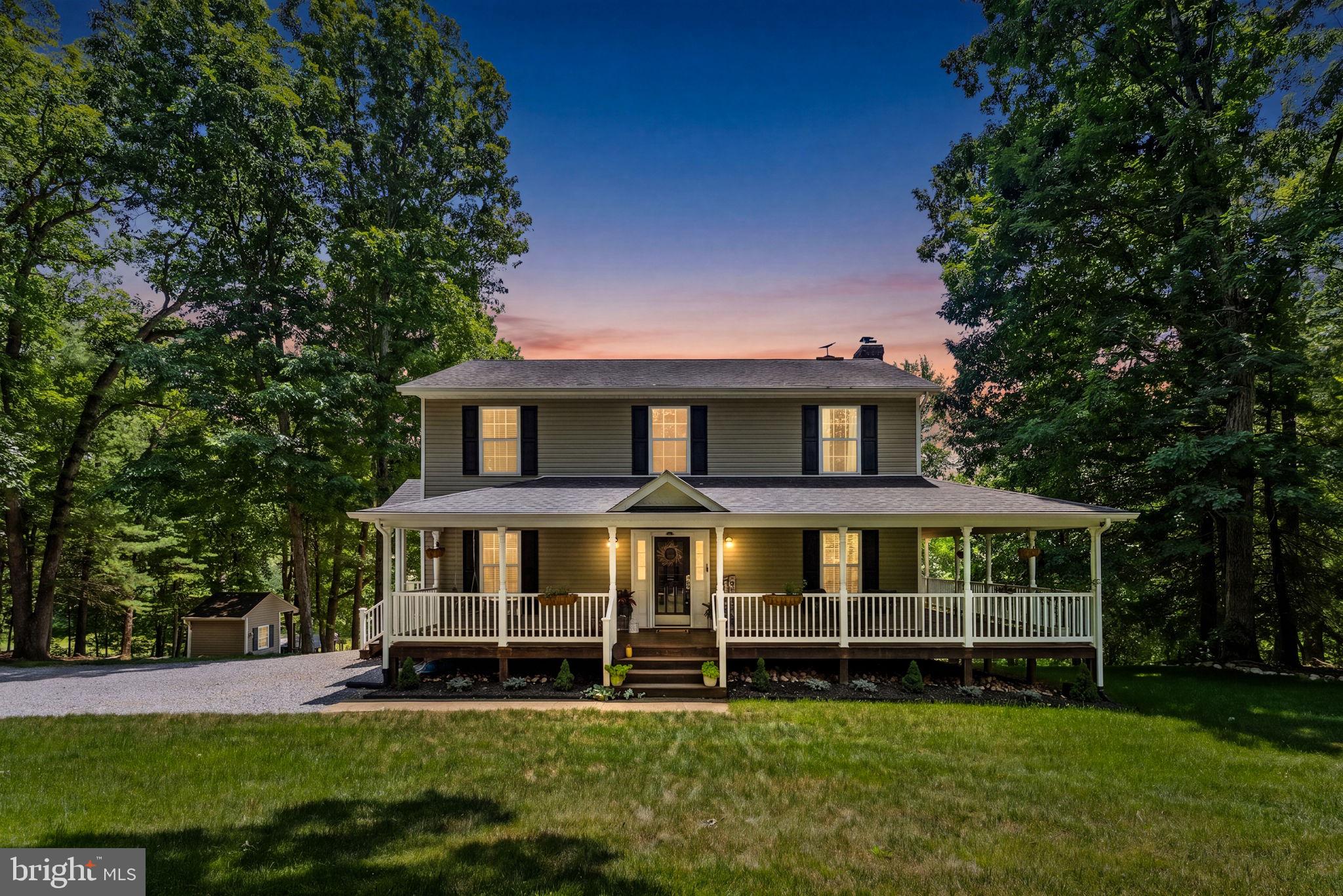 Welcome home to your own private retreat in the heart of Reva. Set on 3 peaceful acres surrounded by mature trees and picturesque countryside, this property offers the perfect balance of privacy, comfort, and outdoor living.

From the moment you arrive, you'll appreciate the inviting covered front porch that wraps around to an expansive covered deck, creating the ideal space to relax, entertain, or simply enjoy the peaceful views. Gather around the outdoor wood-burning fireplace on cool evenings, sip your morning coffee while listening to the birds, or unwind after a long day surrounded by nature.

The property is thoughtfully designed for those who appreciate country living, complete with a charming chicken coop—and yes, the chickens can convey! Whether you've dreamed of collecting fresh eggs, gardening, or simply enjoying the serenity of wide-open spaces, this property offers the lifestyle you've been searching for.

If you're looking to escape the hustle and bustle without sacrificing comfort, you'll love the sense of peace and tranquility this special property provides. Come experience the beauty, privacy, and charm that make this home truly one of a kind. 


*Additional photos coming soon*