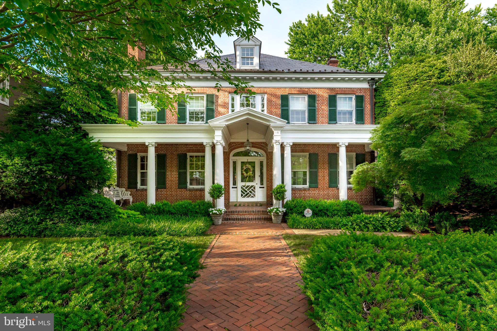 This stately restored, 1917 Georgian Revival home is located on a prominent double lot  in the neighborhood of Murray Hill.  It is  beautifully landscaped with specimens trees, plantings and flower gardens, a private lap pool & entertaining area, a screened  porch off of the kitchen & 1 car garage. The spacious 4  Bedroom, 4 1/2 bath  residence retains many original elements & details of the  home including  the front door, the staircase, floors, millwork & doors which are complemented by a stunning  3 year old state of the art gourmet, white kitchen with white custom cabinets, countertops & high-end appliances. This home  includes a classic library w/ gas fireplace, separate elegant living room with fireplace and  music room, a formal dining room and  spacious bedrooms/office spaces. The primary suite features a fire place, walk-in closet, laundry, bath with double  vanities & extends to include a private office. The home has a Buckingham slate roof with copper gutters. 3-Zone heating and cooling.