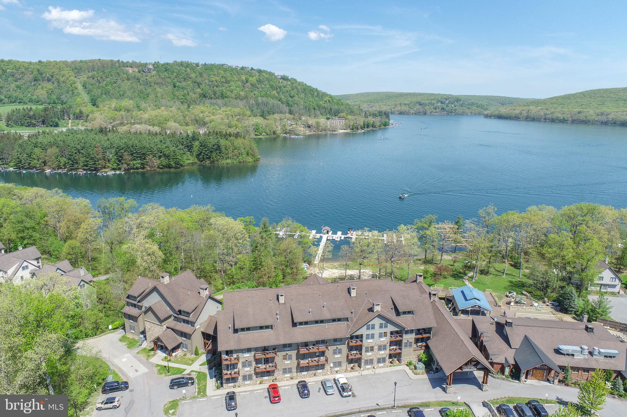 Enjoy easy vacation living in this fully furnished one-bedroom suite at Silver Tree Suites. Ideally located on the second floor, this unit offers a private deck and convenient access to the library, sitting lounge, and lake-view common areas overlooking the grand lobby fireplaces.

Owners and guests enjoy access to a fitness center, sauna, game room, laundry facilities, and meeting spaces. Silver Tree Suites is a well-established vacation rental destination, making this an excellent opportunity for personal enjoyment and rental income potential.

Condo dues include public water, sewer, trash service, hot water, and propane for the fireplace and water heater, adding value and convenience to ownership.

Located on-site are Silver Tree Marina, Dutch’s at Silver Tree, and Harbor Bar, placing some of Deep Creek Lake’s favorite attractions just steps away. Whether you're looking for a weekend getaway, investment property, or both, this turnkey lake-area retreat is ready to enjoy.