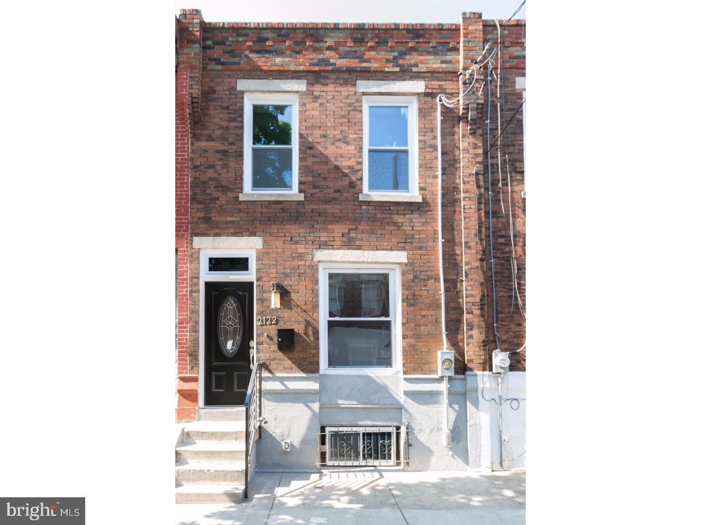 Welcome to this tastefully renovated 3 bedroom, 1.5 bath town-home in hot Point Breeze! Property has been completely updated throughout. Curb appeal galore with beautiful decorative brick and transom front door. Enter into modern open concept floor-plan with stunning hard-wood floors, recessed lighting throughout and modern hand forged metal interior railings. Kitchen is brand new with custom 40" shaker style white cabinetry, granite counter-tops and stainless steel appliances. The back splash is a stunning glass bread-stick pattern. Plenty of counter-space and a bonus base/ coffee nook with cabinets and pendant lights in this fully loaded kitchen. For entertaining and sheer convenience, there is a half bath on the first floor with a beautiful storage vanity. Exit into cement fenced-in rear yard perfect for pets and/or bbq. Upstairs has 3 nice size bedrooms with ample closet space.  Full bath on 2nd floor with new vanity and a special glass tile accent in the shower. Plenty of natural light soaks into the home on both floors. Central air and all new mechanical's. Full basement provides plenty of room for storage and convenient laundry area. Block is private and parking is easy. Area has prolific development going on making this a substantial investment opportunity. Property is vacant and ready to go! Just unpack your bags! Make your showing today.