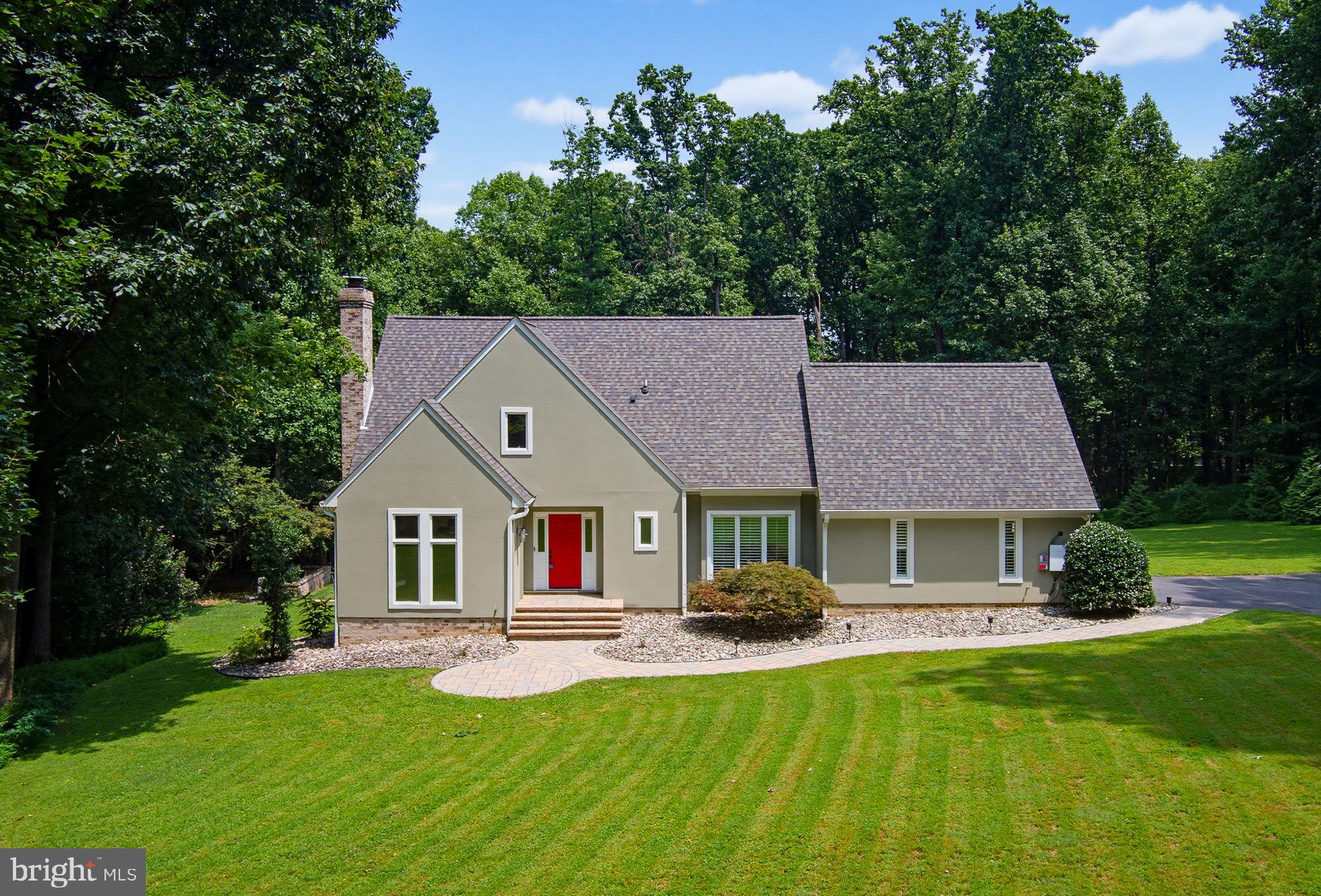 This stunning home is tucked away at the end of a quiet cul-de-sac in the highly sought-after Abbington Farms community and is sure to impress! Nestled on approximately 3 private acres, this exceptional property offers the perfect blend of luxury, privacy, and convenience, all just minutes from downtown Frederick and with no city taxes.

Designed to seamlessly blend indoor and outdoor living, the home is filled with dramatic floor-to-ceiling windows that bathe the interior in natural light while showcasing breathtaking views of the surrounding landscape. At the heart of the home, the beautifully appointed kitchen features modern cabinetry, stunning soapstone countertops, and premium appliances, including a gas range (2023). Just beyond, the dining room provides an elegant setting for family dinners and holiday gatherings, while the inviting living room is anchored by a cozy wood-burning fireplace.  A family room opens into the bright sunroom, creating the perfect spaces to relax and enjoy every season. A convenient main-level bedroom with a private ensuite bath and an additional half bath completes the first floor, offering an ideal retreat for guests or multigenerational living.

Upstairs, the thoughtfully designed layout offers exceptional flexibility to suit a variety of lifestyles. The spacious primary suite overlooks peaceful wooded views and includes an adjoining flex room that is perfect as a home office, nursery, fitness room, dressing room, or creative studio. The beautifully renovated spa-inspired bathroom is a true showstopper, featuring a fireplace, soaking tub,  walk-in shower, and dual vanity for the ultimate retreat. An additional bedroom also offers an adjoining bonus room with potential for a  hobby space, home office, yoga room, or whatever best fits your needs. This versatile upper level is designed to evolve with your lifestyle.

The newly finished walkout lower level (2024) adds exceptional living space with a stylish modern-industrial design. Featuring a private entrance, direct access to the backyard and pool, a kitchenette and bar area, a den or optional bedroom, a full bath, and a dedicated laundry room, this versatile level is ideal for an in-law suite, private guest quarters, or apartment-style living.

Step outside to your own private backyard oasis! The custom patio, complete with a six-person hot tub, overlooks the spectacular heated in-ground pool installed in 2023. Designed for effortless enjoyment, the pool features an automatic cover, app-controlled lighting and fountains, an ozonator, and UV and sand filtration systems. Professionally landscaped grounds with mature trees,  and decorative river rock completes this peaceful outdoor retreat.

Additional highlights include a whole-home water filtration system with UV purifier, septic system pumped and serviced (2026), newly finished driveway, new garage door (2026), new garage door opener (2024), sealed textured garage floor, two Tesla Powerwall backup batteries, and a 40-amp Tesla Wall Charger.

Optional HOA membership of just $75 per year provides access to the neighborhood clubhouse and pond.

Offering luxurious indoor and outdoor living, exceptional updates, energy-efficient features, and an unmatched private setting, this one-of-a-kind property truly has it all. Welcome home to 7319 Abbington Court.