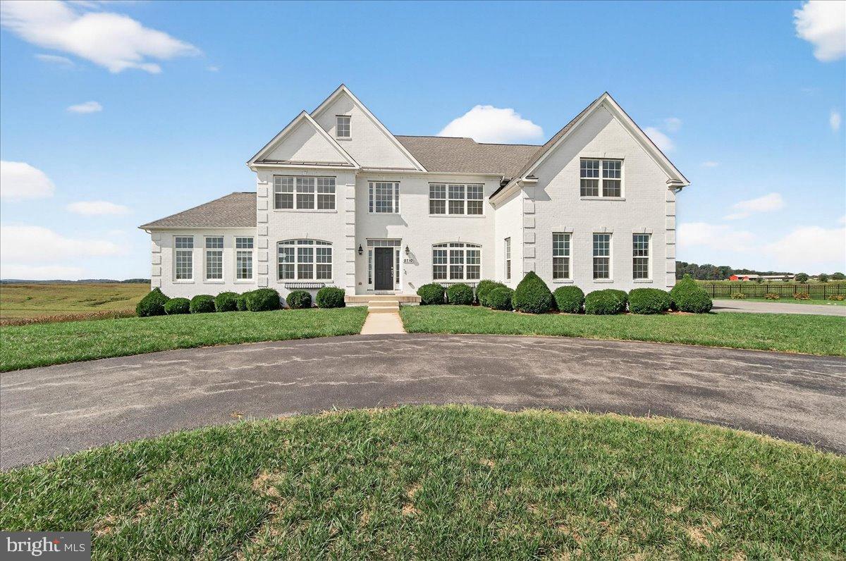Imagine waking up every day at 8710 Dollyhyde Road and taking in panoramic views of lush countryside from your very own white brick colonial, now available for rent at $5,500 per month. Nestled on two acres with more than 100 acres of farm surrounding it, this rental home blends timeless elegance with a welcoming, country lifestyle.

You’ll have room to grow and thrive with approximately 8,900 sq ft of living space, including four large bedrooms, three full baths, and two half baths. Gleaming hardwood floors, built-in shelving, and abundant natural light create a warm, inviting atmosphere. A striking two-sided gas fireplace anchors the main living areas, offering cozy ambiance from multiple rooms. Cooking and entertaining are a joy thanks to the spacious pantry, stainless steel appliances, and an open-concept kitchen that flows effortlessly onto a Trek deck—a perfect spot for enjoying sunrise coffee or sunset gatherings.

Some highlights that make this rental property truly special:

    •    Primary Suite: His-and-hers closets plus an en-suite bathroom featuring dual sinks, a separate shower, and a soaking tub with breathtaking farm views.
    •    Conveniences: Dedicated media room, heated floors for winter comfort, a gated driveway, and a backup generator for peace of mind.
    •    Outdoor Amenities: A fenced area, shed, side-load garage, and a charming greenhouse accessible directly from the house, so you can nurture your plants year-round without stepping outside.
    •    Additional Luxuries: A washer and dryer, thoughtfully designed built-ins, and plenty of room to customize spaces for work or hobbies.

With its sweeping views, modern conveniences, and abundant space, this home offers all the comforts of luxurious living with a relaxed country feel—available for lease to those ready to embrace a tranquil lifestyle at $5,500 per month.