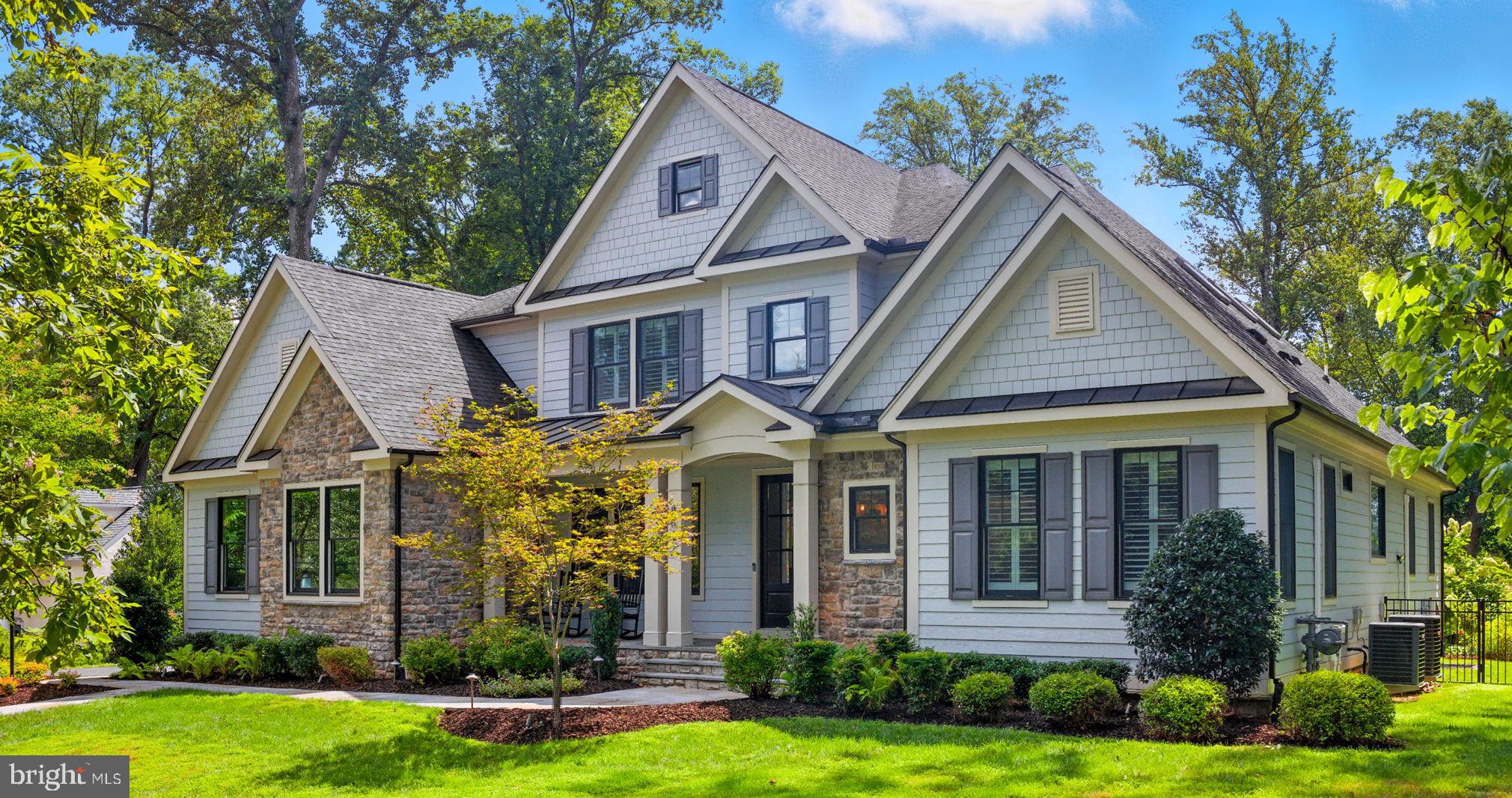 Welcome to 8617 Dixie Place — a masterfully crafted, custom residence by an esteemed McLean builder built in 2018, perfectly situated in the exclusive and secluded Woodside Estates. This extraordinary home offers almost 8,000 SF, 6 bedrooms, an additional loft and bonus room, 5 full bathrooms, and 2 half bathrooms, all thoughtfully designed for both grand entertaining and everyday comfort. Set on a lush and private 1.25-acre lot with an expansive 3-car garage, the property offers a rare combination of tranquility and convenience, just minutes from Tysons Corner, downtown McLean, and Washington, D.C., and currently zoned for Spring Hill ES / Cooper MS / Langley HS. No HOA!
 
From the moment you arrive, the home’s stately presence and meticulous craftsmanship are evident. Inside, the main level is flooded with natural light and enhanced by 9’+ ceilings, wide-plank red oak hardwood floors, and Andersen windows with upgraded black exteriors. The main-level owner’s suite is a serene retreat featuring bay window seating, a spacious, custom designed walk-in closet, and a spa-inspired bath with a freestanding soaking tub, Carrara marble countertops, and high-end finishes.
 
The gourmet kitchen is a chef's dream and the heart of the home, appointed with Wolf and Sub-Zero appliances, quartzite countertops, custom cabinetry, and an extra-large center island, seamlessly flowing into the breakfast area, and keeping room. Additional features of the main level include a functional laundry and mud room with custom built-ins, an office or study and an inviting family room with a coffered ceiling where a gas fireplace with a custom Douglas fir mantle and built-ins on each side serves as a stunning and warm focal point. French doors open to the covered travertine patio, complete with recessed lighting, ceiling fans, and outdoor electric heaters, overlooking the custom saltwater heated pool and spa with waterfall, a sports court, a welcoming fire pit, and fully fenced backyard. Whether hosting elegant evening gatherings or relaxed weekend barbecues, this space is designed for year-round enjoyment.
 
Upstairs, hardwood floors continue in generously sized bedrooms, two with its own en suite bath, along with a finished loft and bonus room. 
 
The walk-out lower level expands the living space with a fitness room or media room, bedroom with full bathroom, rec room and an inviting wet bar with custom cabinets, quartz countertops, and bar sink. A changing closet and powder room with porcelain tile are conveniently located for pool access.
 
Additional features showcase the homeowner’s attention to detail and commitment to quality, including HardiePlank siding, gutter guards, a whole-home generator, a water filtration system, upgraded lighting and plumbing fixtures throughout, a sprinkler system, and expertly crafted custom closets in every bedroom and storage space. Every bathroom is thoughtfully designed with premium countertops, custom cabinetry, and elegant flooring, delivering a consistent and elevated sense of luxury throughout the home.
 
This is more than a home — it’s a private sanctuary offering elegance, comfort, and modern convenience in one of Northern Virginia’s most desirable neighborhoods. Welcome Home!