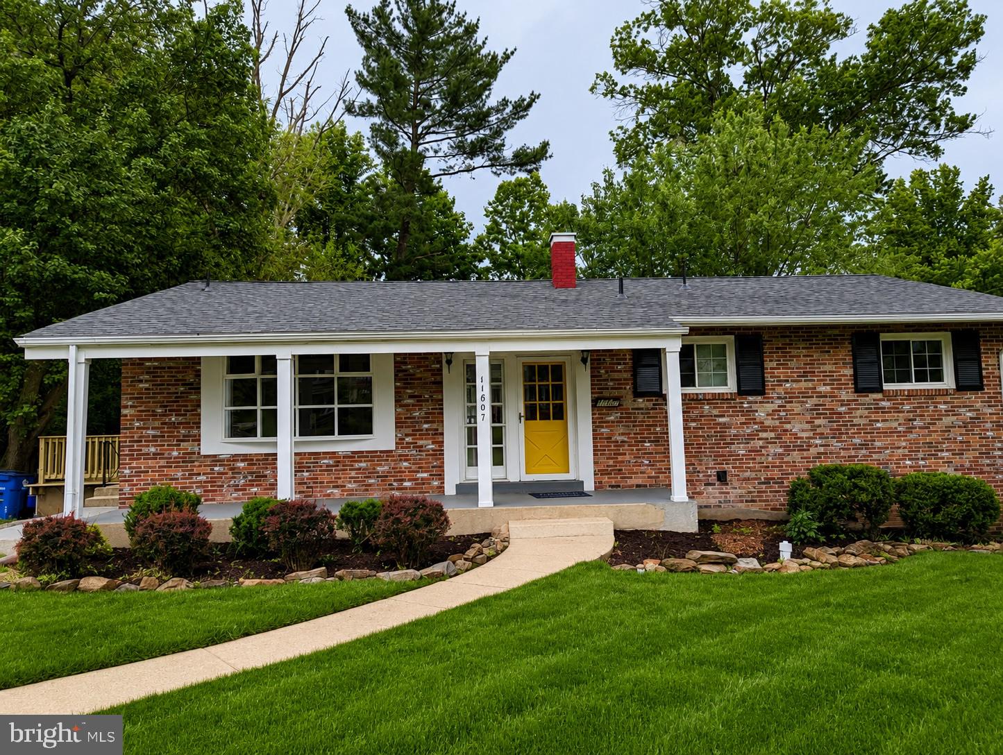Back on the market because the buyers' circumstances changed, and ready for its next owner! This charming all-brick ranch sits on a quiet street in the popular Kemp Mill neighborhood of Silver Spring, offering 4 bedrooms, 3 bathrooms, and 2,820 square feet of well-designed living space. Freshly painted throughout, topped with a brand new roof, and truly move-in ready. The main level features a wide, light-filled entryway that opens to a living room and dining room with beautiful hardwood floors throughout. The open concept flows naturally into a breakfast area with stunning beamed ceiling detail, and a kitchen with rich wood cabinetry, granite countertops, and stainless steel appliances. A large deck off the kitchen is perfect for outdoor dining and entertaining. Updated windows and doors bring in great natural light. The primary bedroom is a generous size with double closets, a built-in dresser, and a refurbished en-suite bath with beautiful tiles and vanity sink. Two additional bedrooms and a refurbished full hall bath complete the main level.
The fully finished lower level adds tremendous flexibility with an expansive recreation room featuring built-in library shelving and double doors that open directly to the paver patio, a large bonus room with LVP floors ideal for an office or exercise space, a fourth bedroom, full bath, and a large laundry and storage room.
Outside, a huge backyard and paver patio round out the outdoor space. Located near a swim club and with easy access to major commuter routes, this one checks a lot of boxes. The previous contract did not reach the closing table, and this is your opportunity.