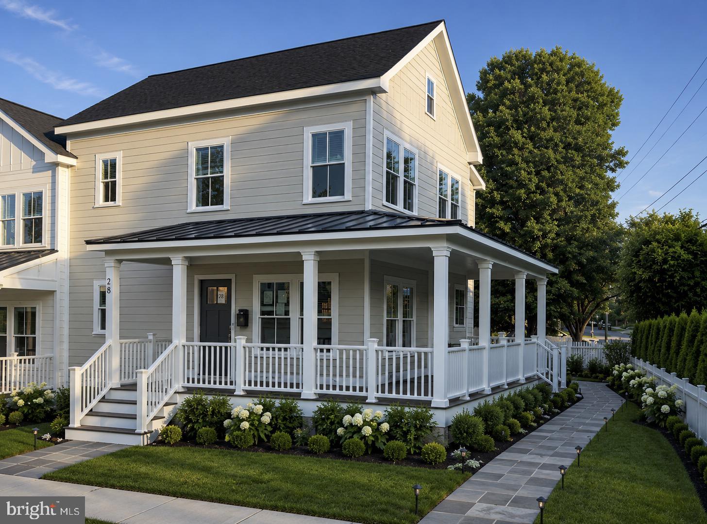 Not Twins...Just Sisters!

Perfectly positioned in the heart of Rosemont, in the shadow of the iconic George Washington Masonic National Memorial, these exceptional semi-detached residences by Bluestone Builders offer an extraordinary blend of timeless craftsmanship, sophisticated design, and an unrivaled location. Just minutes from Old Town Alexandria, Del Ray, King Street Metro, Amtrak, and VRE, you'll enjoy the convenience of urban living with the charm of one of Alexandria's most treasured neighborhoods.
28 W. Chapman Street is the larger of the two "sisters," gracefully situated on a generous 3,347-square-foot lot and offering approximately 3,050 square feet of beautifully appointed living space. Although built side by side, these homes are far from identical. Each residence showcases its own distinctive floor plan, designer lighting, curated finishes, and thoughtful architectural details, creating a home with its own personality and style.
A welcoming wraparound porch introduces an interior where timeless design meets modern comfort. Sunlight pours through oversized windows, illuminating wide-plank oak flooring, soaring 9-foot ceilings, and an elegant turned staircase anchored by a statement chandelier. The inviting living room, centered around a gas fireplace, flows seamlessly into the dining area and gourmet kitchen, creating spaces that are equally suited for intimate evenings or lively gatherings.
The kitchen is a true showpiece, featuring custom two-tone cabinetry, GE Café appliances, quartz countertops that continue into a full-height backsplash, an oversized center island, and abundant storage. Every detail has been thoughtfully selected to blend beauty with everyday functionality.
Upstairs, the serene primary suite with bath and a custom-designed walk-in closet, while two additional bedrooms are generously proportioned and filled with natural light and share a large hall bath with double vanity and separate area for showering. Every closet throughout the home has been professionally outfitted with custom organization systems, reflecting the home's attention to detail and effortless livability.
The finished lower level provides exceptional flexibility with a spacious family room, a private guest suite with an ensuite bath, and a beautifully designed laundry room complete with custom cabinetry, utility sink, and full-size stacked washer and dryer. Exceptional storage ensures there's a place for everything.
Outdoor living is equally impressive, with a private bluestone patio, landscaped green space, and a gracious wraparound porch that invites morning coffee, evening cocktails, and relaxed weekends at home. The off-street driveway is EV charger-ready, blending modern convenience with timeless appeal.
Perhaps the home's greatest luxury is its walkable lifestyle. Leave the car at home and stroll to neighborhood cafés, boutiques, acclaimed restaurants, parks, and community events in Rosemont, Old Town, and Del Ray. Metro, VRE, and Amtrak are only a few blocks away, placing Washington, D.C., National Landing, and beyond within effortless reach.
Rich in character, filled with natural light, and crafted with exceptional attention to detail, 28 W. Chapman Street offers the rare opportunity to own luxury new construction in one of Alexandria's most beloved and established neighborhoods.

They're not twins...they're sisters—each with her own personality, style, and story.