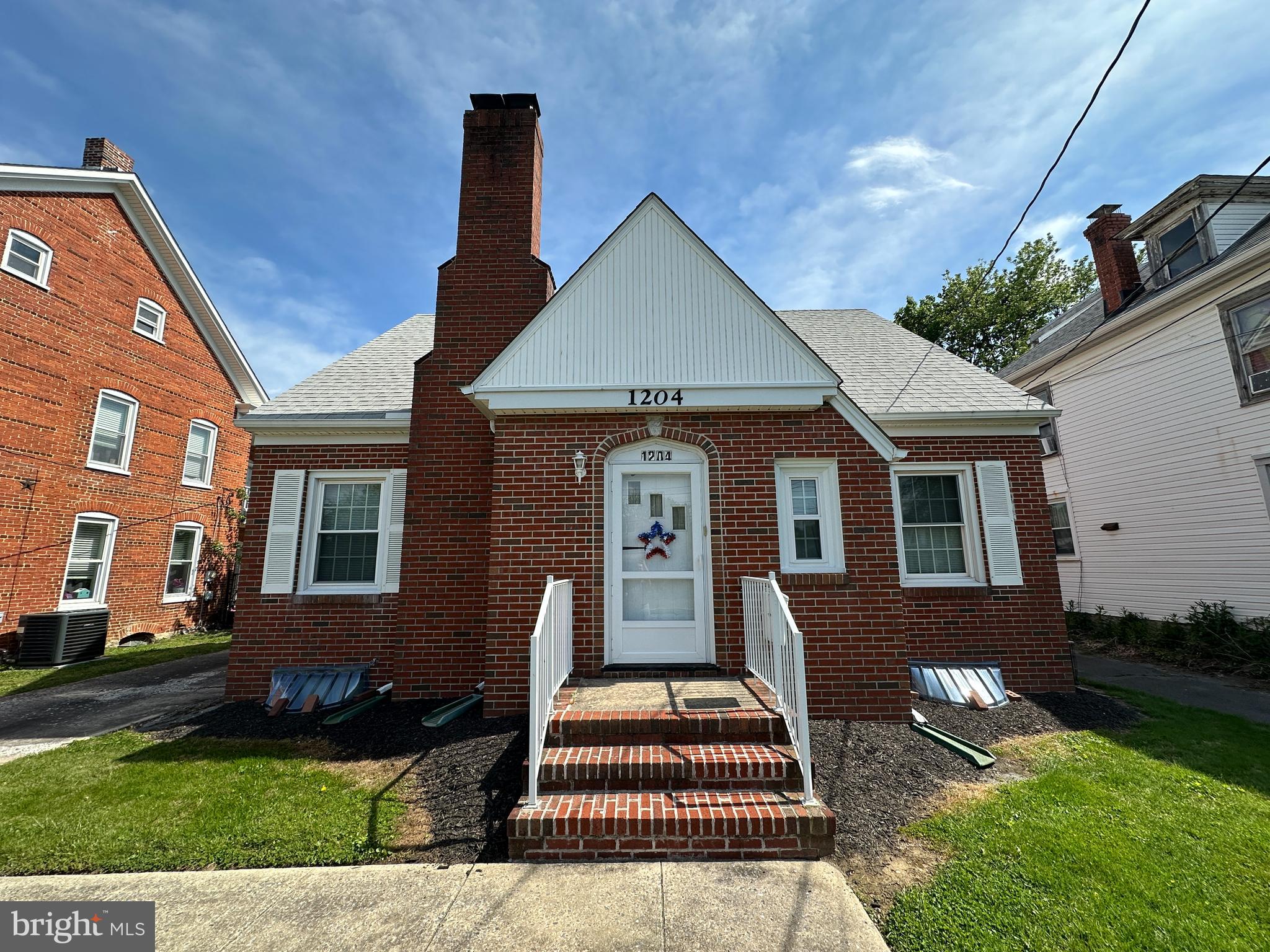 NICE BRICK ENGLISH COTTAGE STYLE HOME IN HAGERSTOWN, MD! This charming home has remained in the same family since it was built! The home features 4 bedrooms, 2 full bathrooms, a living room with fireplace, kitchen, and a full basement. Hardwood floors extend throughout the home! Outside, enjoy convenient driveway access from Virginia Ave, as well as additional access from the rear alley to a spacious driveway with room for multiple vehicles. There is also a detached 2-car garage. Both the house roof and garage roof were replaced in 2016! Excellent location just minutes from I-81, I-70, shopping, recreation, and more! With some modifications, the property also offers duplex potential. Come make this home your own! This property will be offered at auction on Tuesday, June 23, 2026, at 4:30PM. The List price in no way represents a minimum, starting, or acceptable bid.