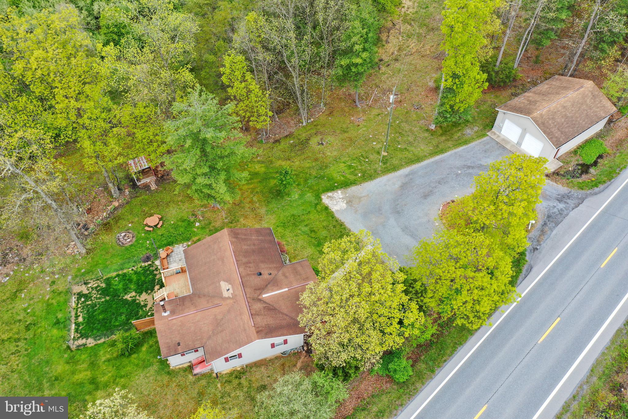 Here is a great opportunity to own a 1312 sq. ft home for $229,000.00 on almost a half an acre.  Locate right off of Rt 522 by the VA line.  3 bedroom, 2 full bathroom, large 15x18 living room, dining area, full kitchen, separate laundry room, mudroom with wood burning stove. Outside you'll enjoy relaxing on the covered front porch, nice back deck and patio area.  The house is nicely landscaped.  HUGE 1000 sq. ft. detached garage with 9ft doors.  Close to Cacapon State Park with golfing, fishing, swimming at the lake, tennis, basketball,  nature center and hiking trails, spa, and catch a bite to eat at the restaurant and more!
 I have multiple offers. Highest and Best due by May 5th.
