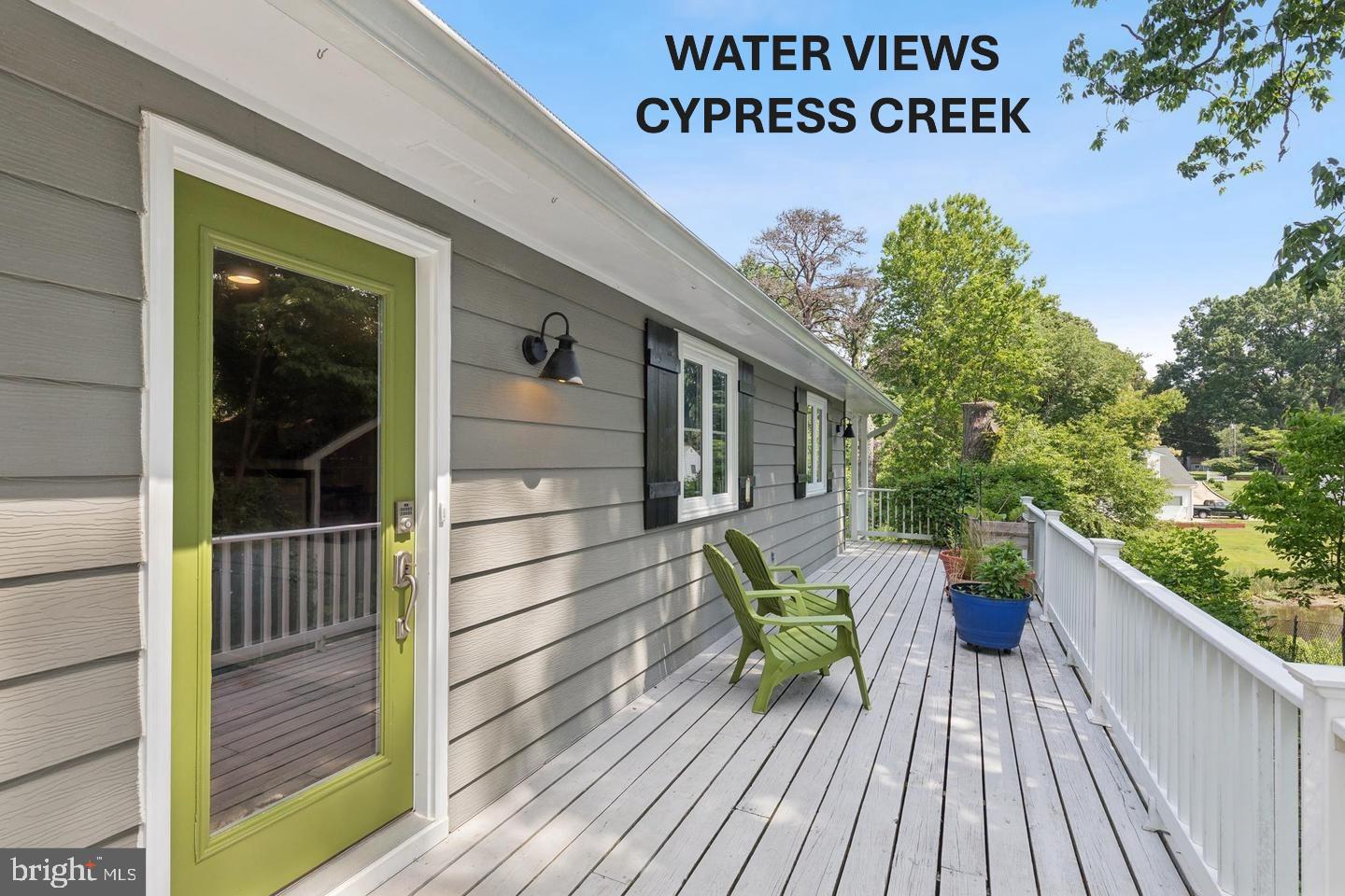 Charming Waterfront Cottage on Cypress Creek

Privately situated at the end of a quiet street, this charming cottage offers peaceful waterfront living with beautiful views of Cypress Creek and abundant natural surroundings. The open-concept floor plan is designed to maximize the scenery, allowing you to enjoy stunning water views from nearly every room.

The updated kitchen features shaker-style cabinetry, stainless steel appliances, and elegant quartz countertops. Inside, you'll find warm wood flooring, a stylish tiled bathroom, and two comfortable bedrooms with one full bath.

Outdoor living is just as inviting, with a spacious wraparound deck and a covered waterside porch—perfect for relaxing, entertaining, or simply taking in the tranquil setting. The unfinished basement provides endless possibilities for additional living space, storage, or a workshop tailored to your needs.

The current owner has thoughtfully landscaped the property with native plants that attract local birds and wildlife, creating a nature lover's paradise right outside your door.

Experience the perfect blend of privacy, waterfront beauty, and cottage charm in this unique Cypress Creek retreat.