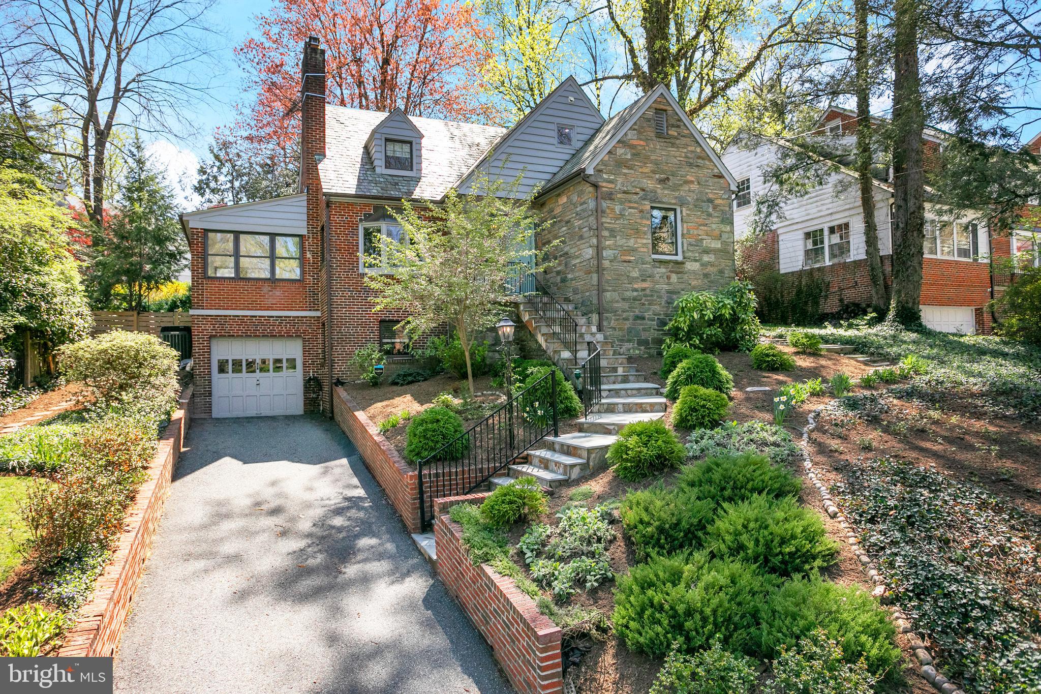 Welcome to this renovated Chevy Chase classic residence in picturesque Rollingwood. The overwhelmingly beautiful hilltop view offers natural light to fill the residence throughout the day.  There are carefully selected design elements on all  levels which incorporate modern amenities, open space and classic beauty. This residence radiates  quiet luxury on a beautiful scale. Be sure to note, the main level open floor plan with a renovated  kitchen for gatherings, and a main floor bedroom/office with a a renovated in suite bath.  Entertain with ease on the landscaped backyard patio overlooking mature and lush gardens. The second level also includes a gorgeous renovated full bath as well as a light filled nursery large enough for king bed and large master bedroom with ample storage. The master bedroom windows offer a lovely view of the expertly landscaped backyard.
The basement level does not disappoint with a half bath, lovely entertaining space and fireplace.  Rock Creek Park is mere steps away and offers endless possibilities for outdoor enjoyment. Historic Meadowbrook Stables & Candy Cane City are certainly  places to visit and are within easy reach. There's even a metro bus stop a few doors away on Leland Street. Convenient to all 3 major airports and DC.