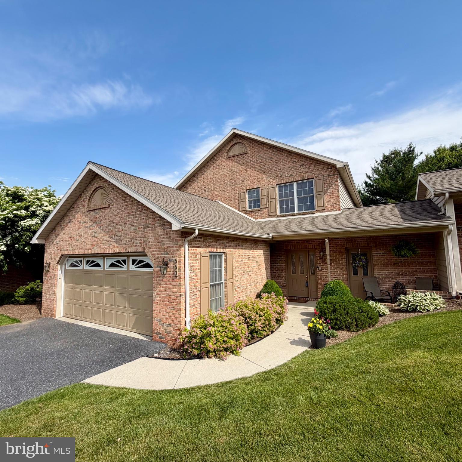 Beautiful 3BR/2.5BA brick townhome with 9 ft. ceilings on both levels and an oversized 2-car garage in desirable Derry Township School District. Located in a quiet 20-unit community on a private road in one of Derry Township’s most desirable neighborhoods, this home offers both privacy and convenience—just minutes from Penn State Health Milton S. Hershey Medical Center, grocery stores, schools, shopping, and major routes.  A large, bright two-story foyer welcomes you into the home, featuring French doors leading to a private office with built-in desk and shelving. The open-concept layout includes a spacious family room with gas fireplace and dining area, flowing into a bright eat-in kitchen complete with Corian countertops, center island, walk-in pantry, double oven, gas range, and abundant workspace for cooking and entertaining.  The spacious primary suite offers two large walk-in closets, double vanity, jacuzzi tub, and separate stall shower.   A large first-floor laundry room adds exceptional convenience with a utility sink, built-in ironing station, hanging rack, and abundant cabinet storage.  In addition to the home’s generous closet space, there is an adjacent storage room with dual access from both the front and rear of the property. The oversized 2-car garage also includes built-in storage above for even more functionality.  Enjoy the quiet, private backyard from the covered porch/patio, complete with an in-ground gas hookup for grilling and outdoor entertaining. Additional features include gas heat, central vac, ceiling fans throughout, and ample storage. HOA services include lawn care and snow removal, providing easy, low-maintenance living year-round. This home offers the perfect blend of comfort, style, storage, and location.