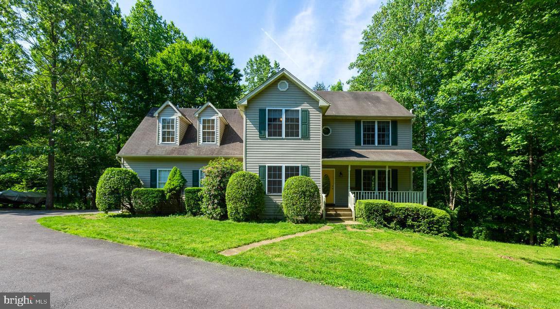 NEW PRICE! Adorable Colonial located in Quail Ridge subdivision. No HOA fees! 3 Bedrooms, 2 Full Baths, main-level powder room. Concrete countertops. Home sits on 1 acre, private backyard backs to trees. Hardwood throughout. Light & Airy home, up-to-date paint colors. MID-FLOOR PLAY ROOM for your entertaining. Walk-in master closet, jetted master tub has seperate shower. Back deck & covered front porch for your enjoyment. New water heater & HVAC. Great location for commuters! Located between Warrenton & Culpeper with old town charm, shops, restaurants, events, waiting for you.