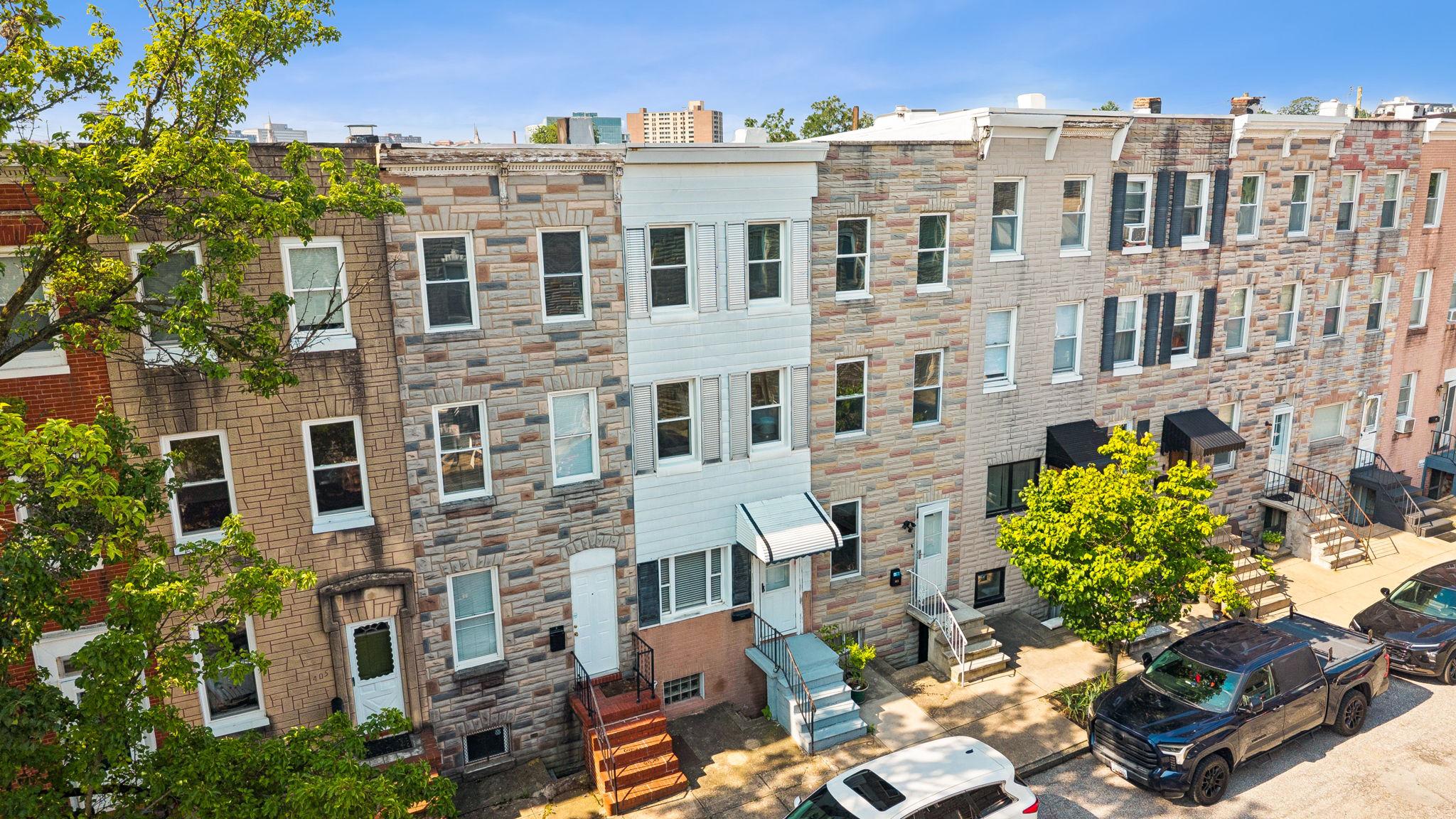 Welcome to 409 W 23rd Street! This gem is one you will not want to miss. Historic charm, generous space, and incredible potential - all in the heart of Remington. This 3 bedroom, 1 bath, three-story Baltimore rowhome is ready for its next chapter. 2021 Furnace and water heater, and Fresh paint and flooring throughout much of the space provides a move-in ready property with a blank canvas for personalization. 
.
The main level offers a comfortable living room and a large eat-in kitchen. The kitchen backs to an existing deck offering up al fresco evenings of dining and fun. The second floor features a spacious bedroom, a full bath and a large walk-in closet. Level 3 has 2 large bedrooms with plenty of closet space and views for days. An unfinished walk-out basement provides abundant storage, laundry, and exciting possibilities for future finished living space, workshop, home gym, or studio. You decide! 
.
Whether you're searching for a place to call home or your next investment, this property is full of promise. 
.
Location is everything, and this one delivers. Nestled on one of Remington's most charming streets, you'll be just moments from neighborhood favorites including R. House, Clavel, Café Los Sueños, and the area's 'hidden gem', along with Johns Hopkins University, the Baltimore Museum of Art, Wyman Park, Hampden, Charles Village, and convenient access to I-83.
.
Remington continues to be one of Baltimore's most exciting and evolving neighborhoods, where historic character meets thoughtful redevelopment and a true sense of community. Come experience the charm, the location, and the opportunity - this is your chance to make your mark in one of the city's most sought-after neighborhoods at a price point that you won't want to miss.
. 
This is an as-is sale. This one won't last, and for good reason. Reach out to List Agent for questions and inquiries!