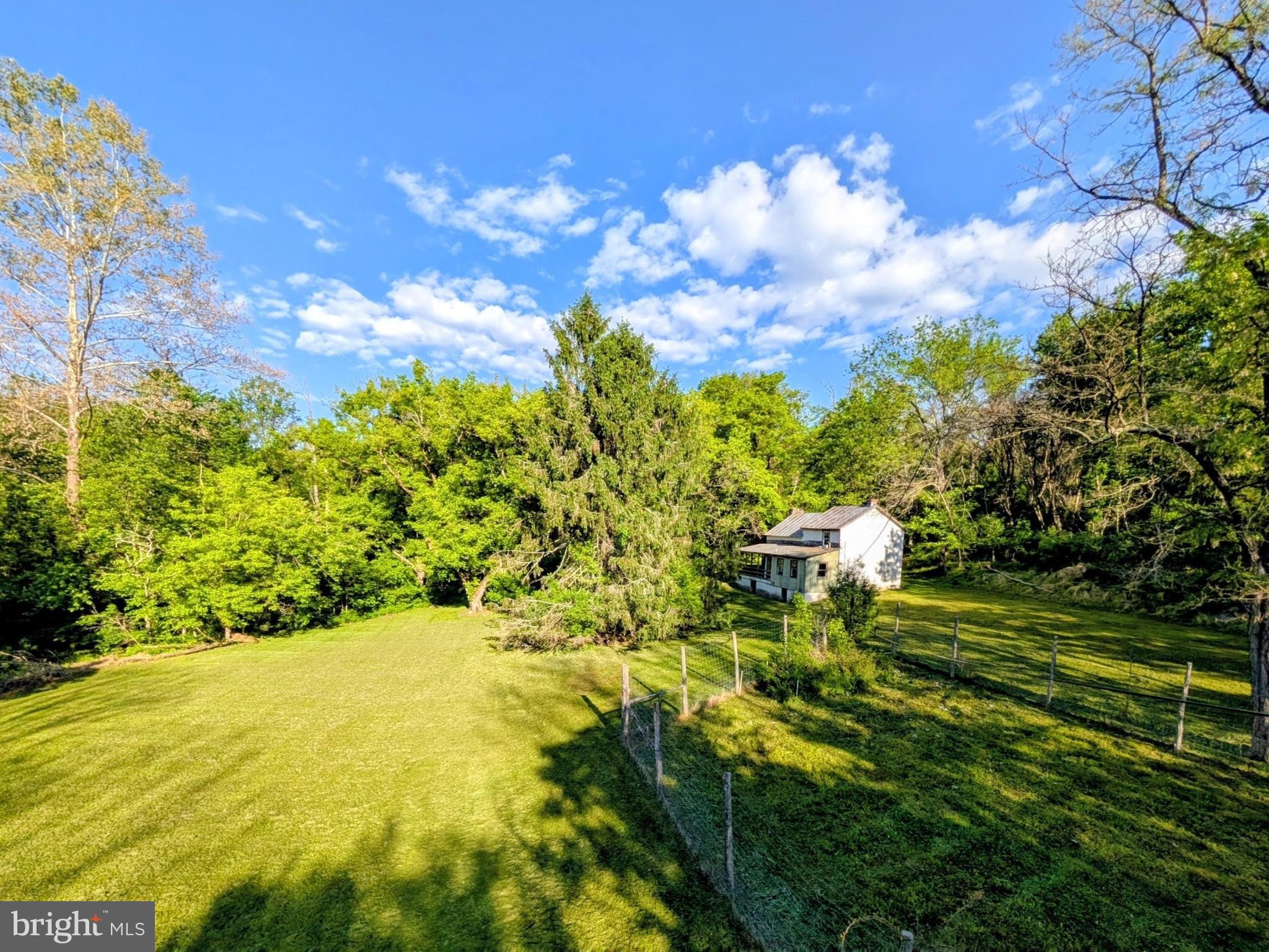 3.5 Acres of Natural Paradise in the Blue Ridge 
Rarely does a property check so many boxes. This 3.5-acre gem sits on a gentle south-facing slope just 2.5 miles from I-66 — convenient to commuter routes yet completely removed from the noise of modern life, with no mountain roads to navigate. 
The land itself is the star. Native plants and wildflowers flourish across the property, creating a haven for wildlife in every season. Bird enthusiasts take note — migrating warblers are currently gracing the property, a beautiful reminder of the rich natural ecosystem thriving here. Whether you're an avid birder, a gardener, a hiker, or simply someone who wants to wake up surrounded by nature, this property delivers. 
A natural cistern/spring provides on-site water, a 2-bedroom septic system is already installed, and a professionally fenced garden enclosure — 8 feet high and set below grade to deter even the most determined wildlife — is ready for immediate use. The gentle southern exposure makes this ideal for homesteading, gardening, or simply soaking in the beauty of the Blue Ridge foothills. 
History runs deep here. The existing structure dates to the 1800s and was once part of the storied Piedmont Orchard operation — featuring what appears to be original chestnut construction and a stone chimney that has stood for generations, with a later addition rounding out the footprint. There's a reason someone built here over 200 years ago — this land simply has everything. 
Adventure and amenities are never far away. The Appalachian Trail is just a stone's throw, accessible via private property along Piedmont Orchard Road. Front Royal is just minutes away, and the surrounding region offers an incredible array of wineries, cideries, historic orchards, and the stunning rolling countryside of Warren, Rappahannock, and Fauquier counties — some of Virginia's most beloved and scenic destinations. 
Whether you envision a new custom home, a weekend retreat, a homestead, or a nature sanctuary, this property offers the infrastructure, location, and natural beauty to make it happen. The existing structure will convey strictly as-is. 
Hold Harmless Agreement required prior to property access. Please contact the listing agent before scheduling. Property also listed as residential. All studies and inspections at buyer's expense.