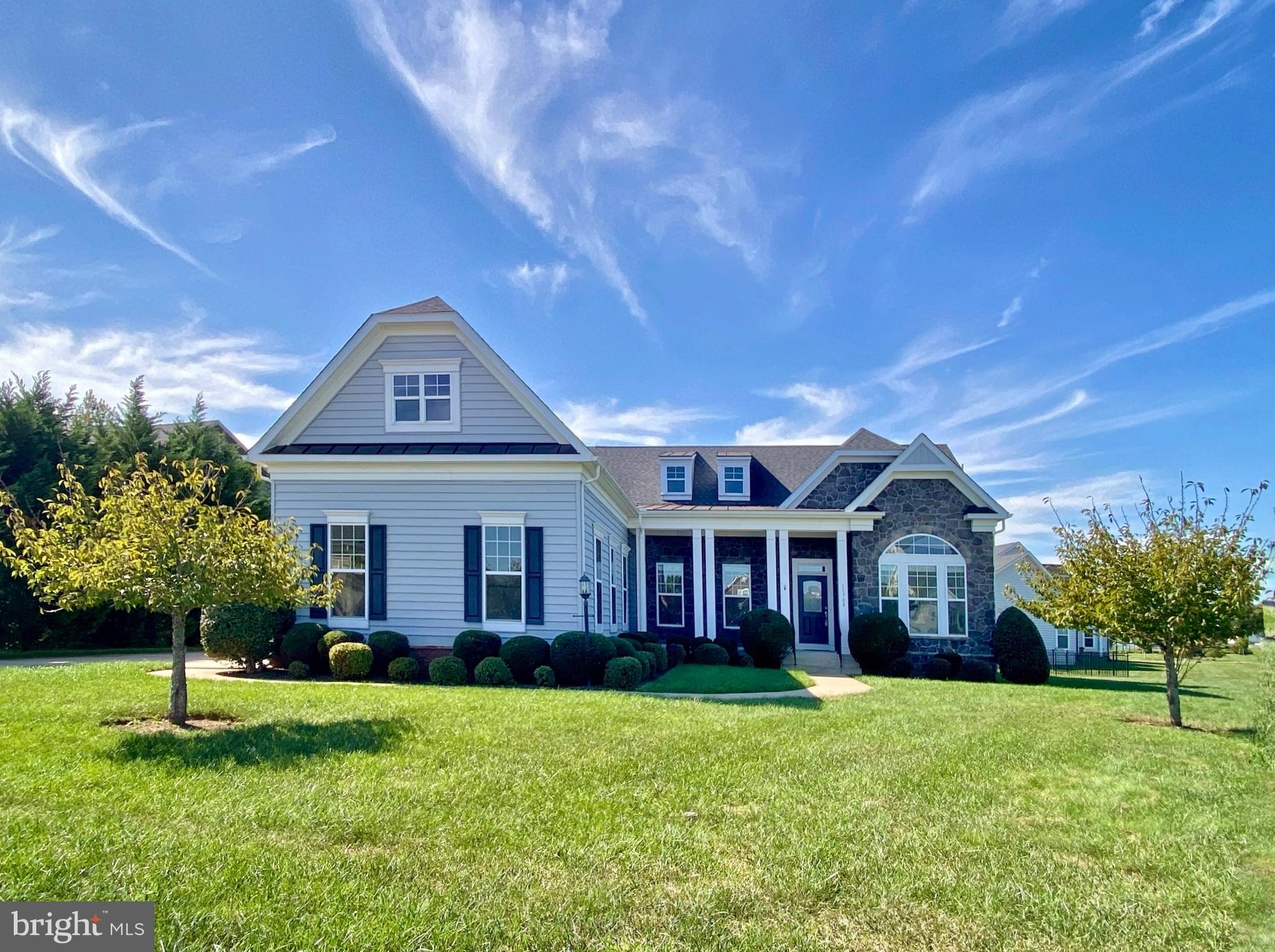 Located inside the gated Fawn Lake community, this ​gorgeous Dream Home features a ​modern, flowing​ and bright interior accented with luxury elements designed for today's ​lifestyle. With ​over 5​000 SQ FT of exceptional interior space, this residence is designed for both casual daily living and effortless entertaining.
The ​amazing floor plan features ​upgraded finishes such as​ granite countertops, wood floors, ​vaulted ceilings and tall windows elevating the spaces throughout the home. A charming front porch welcomes you inside to a​n inviting Foyer anchored by a Formal Dining Room with ​a Butler's ​Pantry and a ​Living Room filled with natural ​sunlight.
A ​beautiful Family Room with a gas fireplace and two story vaulted ceiling opens to the Chef's Gourmet Kitchen featuring white ​cabinetry, ​granite countertops, massive center island, stainless steel appliances, gas cooktop, and a large walk-in pantry. The adjoining Breakfast Room flooded with brilliant sunlight, leads to ​the outdoor expansive Trex deck that is perfect for relaxing and entertaining.
The main level Owner's Suite ​features ​double walk-in closet​s and a relaxing Spa Bath ​with a soaking tub and large tile shower. A gracious Bedroom with walk-in closet ​has an adjoining Full Bath. The spacious Mud and Laundry Room with utility sink completes the main ​floor.
The upper level features a ​large Bedroom Suite with a walk-in closet and​ Private Bath.​ A balcony with a Loft space leads to a Den or optional Bedroom.    
Designed for entertaining, the finished lower level features a huge Recreation Room ​with a Built-in Bar​, complete with a beverage fridge and sink​.  A spacious Bedroom with ​a walk-in closet​ and adjoining Full Bath​ is perfect for guests. A huge multi-function room can serve as a theater, gym, or game room. Two large unfinished area​s provide abundant space for storage and future expansion.
The fenced backyard, which backs to trees offering privacy​, and beautifully landscaped grounds​ maximize outdoor living and entertaining. An oversized 3 Car Garage ​with an EV charger, plus an extended concrete driveway offer plenty of space​ for vehicles. The beautifully landscaped yard exudes curb appeal and is easily maintained by the underground irrigation system. ​
Located in a super charming and established area of Fawn Lake featuring manicured lawns, quaint parks and sidewalks for enjoying daily walks, meeting friends and taking in the beautiful sights and sounds of nature. Come experience the Fawn Lake Lifestyle and start enjoying our unique way of life!
​**The beautiful Luxury gated Fawn Lake Community offers amazing amenities such as a private 288-acre boating recreational lake, an Arnold Palmer designed Golf Course, beach, tennis, pickleball, baseball and soccer fields, dog park, volleyball courts, walking trails, Community Club House, marina, fitness center, restaurants, Country Club, playgrounds, and so much more! Located in the countryside near Fredericksburg, Virginia surrounded by parklands and only a few miles to the farm market, wineries, and award winning breweries! Conveniently located to shopping, restaurants, top-rated Riverbend District schools and I-95!