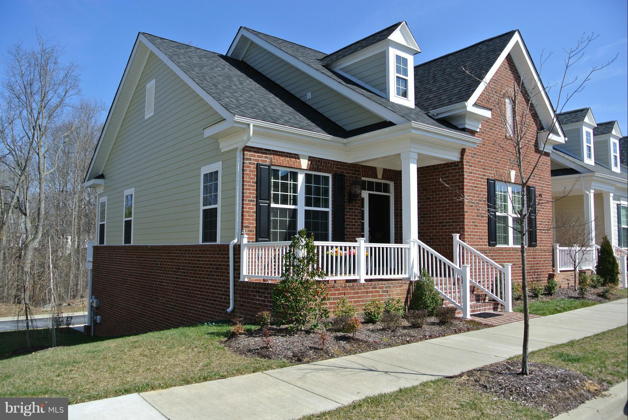 Why wait for new?  This home shows like a model and has all the upgrades.  Beautiful Hardwoods, Built in Cabinets, Huge Kitchen.  Great Location.  Close to Schools Shopping and Commuter Lots.  100% Financing available through USDA Rural Development (If Qualified).  Perfect for today' busy lifestyle.  No lawn work to do, Clubhouse with Pool and Exercise Room. Walking Trails.The list goes on and on.
