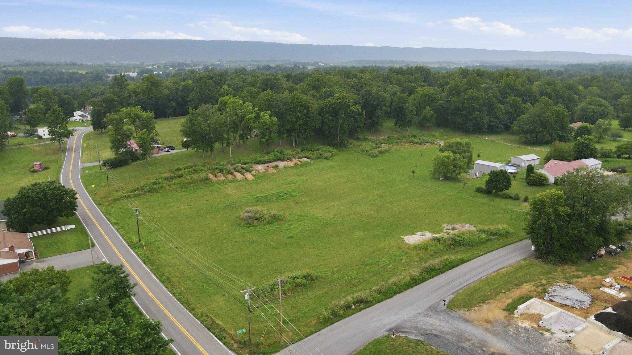 Residential or commercial development. Discover an exceptional opportunity to own 1.89 acres of prime land, perfectly situated in a vibrant and growing community. This expansive parcel offers a blank canvas for your vision, whether you envision a private estate or a development project. This location is characterized by its welcoming atmosphere and proximity to essential amenities directly of I-81. Residents enjoy easy access to local parks, shopping centers, and dining options, ensuring convenience at every turn. The area is well-connected, providing seamless access to major transportation routes, making commuting a breeze. This land offers ample space to build your custom home or business The possibilities are endless,  Seize this rare opportunity to invest in a buildable lot with easy access to all major roads., making it an ideal choice. Explore the potential of this remarkable property today.