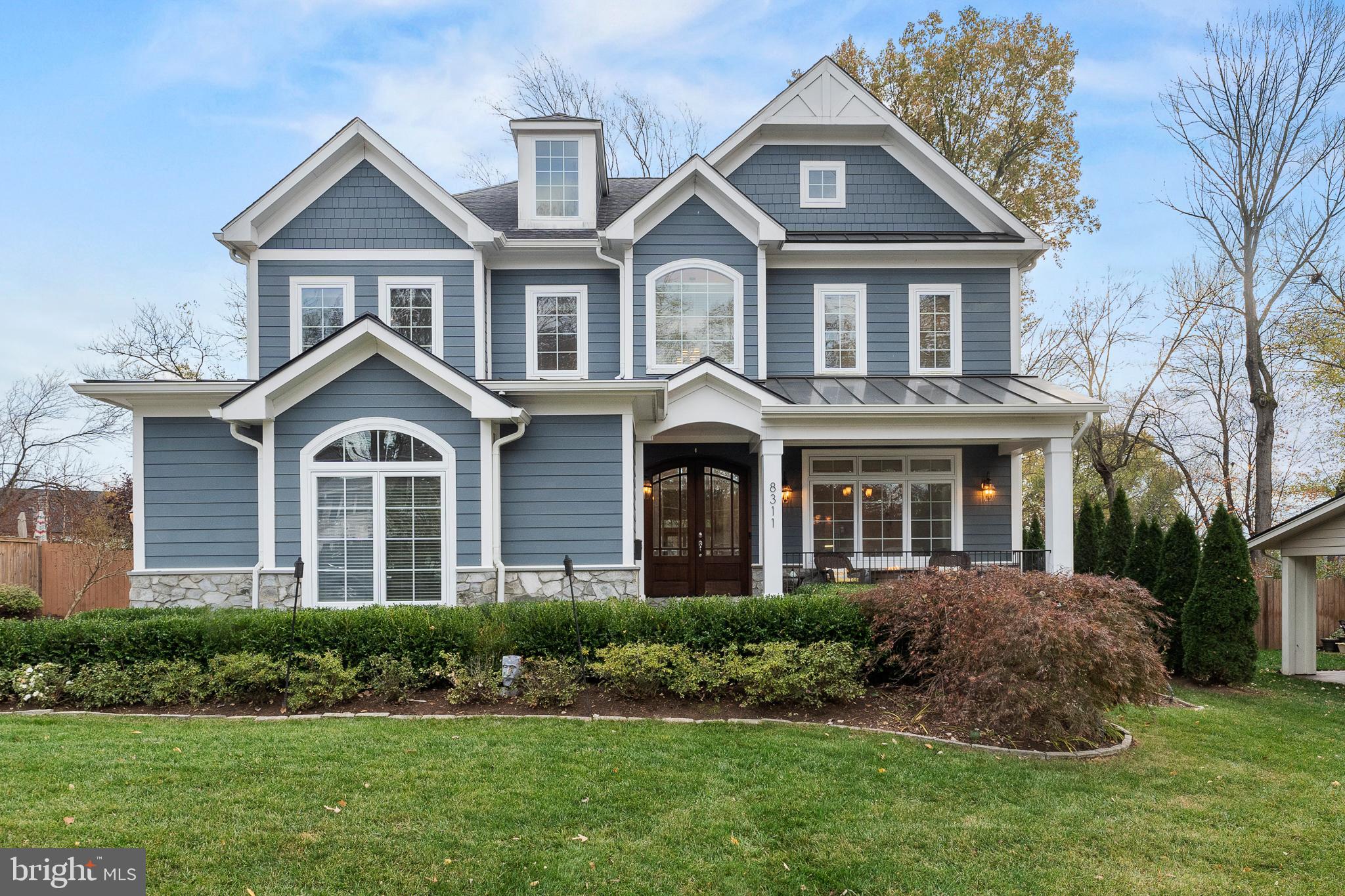 Welcome to this beautiful home in the Dunn Loring Woods subdivision of Vienna Virginia. This custom home features a 3 car, side load garage with Tesla Charger, a flat fenced in backyard with paver patio and gas hardline firepit, deck with retractable awning & gas line for your grill, a wonderful front porch & 5 bedrooms, 5.5 bathrooms on three finished levels totaling just over 6,000 sqft. Gleaming hardwood floors greet you and are throughout the main and second level. Open concept living makes this home perfect for entertaining! The gorgeous gourmet kitchen features Kitchen Aid stainless steel appliances (gas stove and electric wall oven), granite countertops, tile backsplash, walk in pantry, & butler's pantry with fridge. The family room is opposite the eat in kitchen and has a cozy gas fireplace and stunning coffered ceiling. The office is tucked away next to the family room and finishes off the main level. Every bedroom enjoys its own En-Suite, a walk-in closet and hardwood floors. A loft sitting room next to the two-story foyer is a great place to relax and read a book or take a nap. The convenient bedroom level laundry has tons of storage and a sink for those pesky stains. The primary bedroom does not disappoint with a sitting area,  trey ceiling, two walk in closets, and a spa bathroom with a very, very large shower and separate jetted tub. The walk up basement has so many options on how to set it up because it has tons of space! It also features a full wet bar with full size fridge and lots of cabinet storage. The legal bedroom and full bathroom room also give you the option of having the basement as a separate space to be used by in laws, au pairs or whomever you like! Do not miss the video tour in the listing! Welcome and Enjoy!