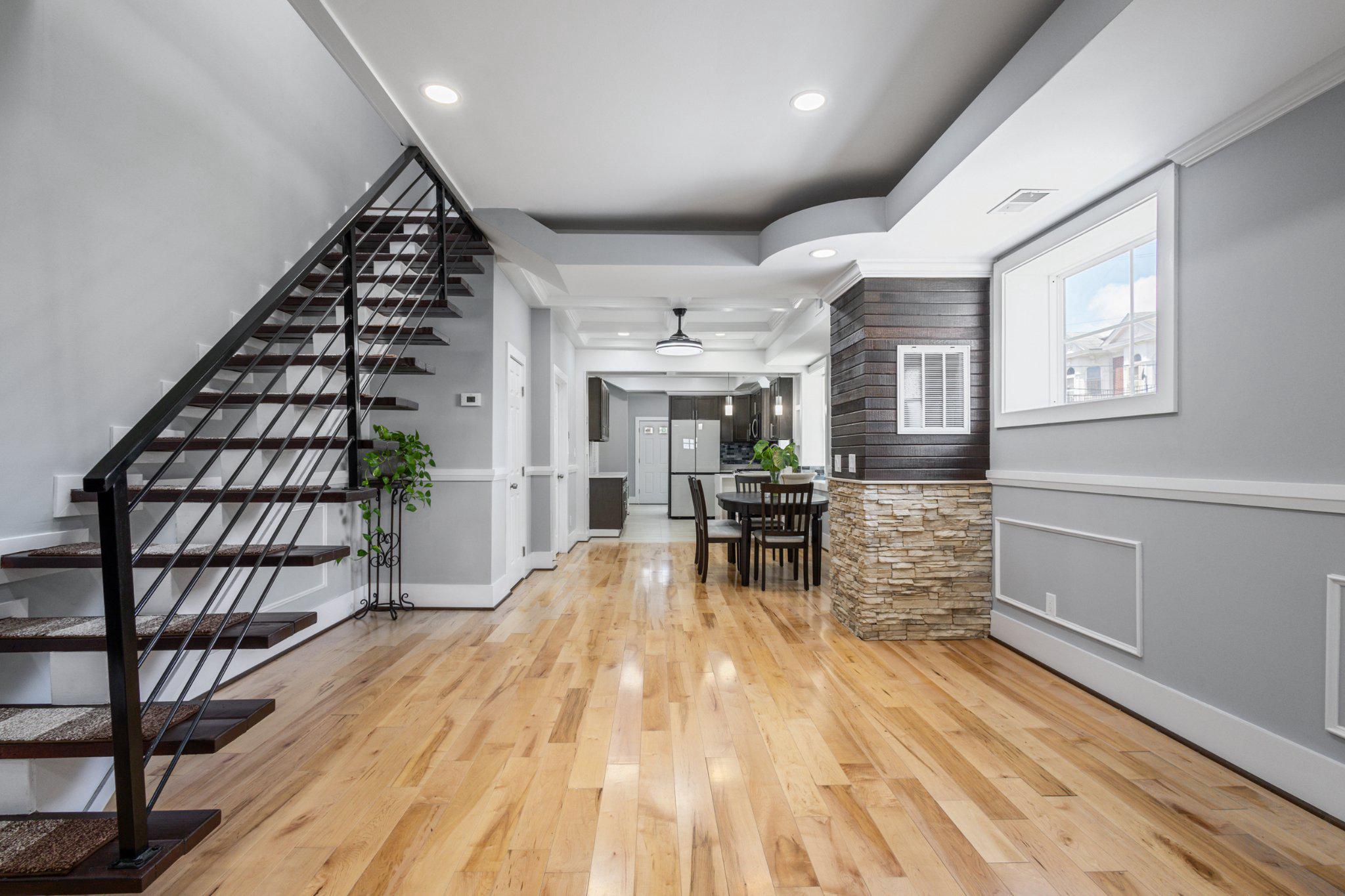 Welcome to 1036 Poplar Grove Street, a beautifully fully updated end unit duplex offering space, flexibility, and modern upgrades throughout! The main level features an open and inviting floor plan with updated hardwood flooring (2023), fresh paint throughout, and abundant natural light. The renovated kitchen showcases white countertops (2023), stainless steel appliances (2024), and direct access to the rear of the home, making it ideal for everyday living and entertaining. Upstairs, you’ll find three generously sized bedrooms, two full bathrooms, and an additional flex space perfect for a home office, sitting area, or potential fourth bedroom. A second main-level den provides even more versatility for today’s lifestyle needs. Major updates include a new roof (2021), hardwood flooring (2023), white countertops (2023), stainless steel appliances (2024), HVAC system (2024), water heater (2024), and fresh paint throughout, providing peace of mind for years to come. The unfinished basement with a separate entrance offers endless possibilities for storage, a home gym, workshop, or future finished living space. Conveniently located near shopping, dining, major commuter routes, and everything Baltimore has to offer. Don’t miss this move-in ready opportunity! Added Bonus: Preliminary title work has been completed by Lawyers Title Express!