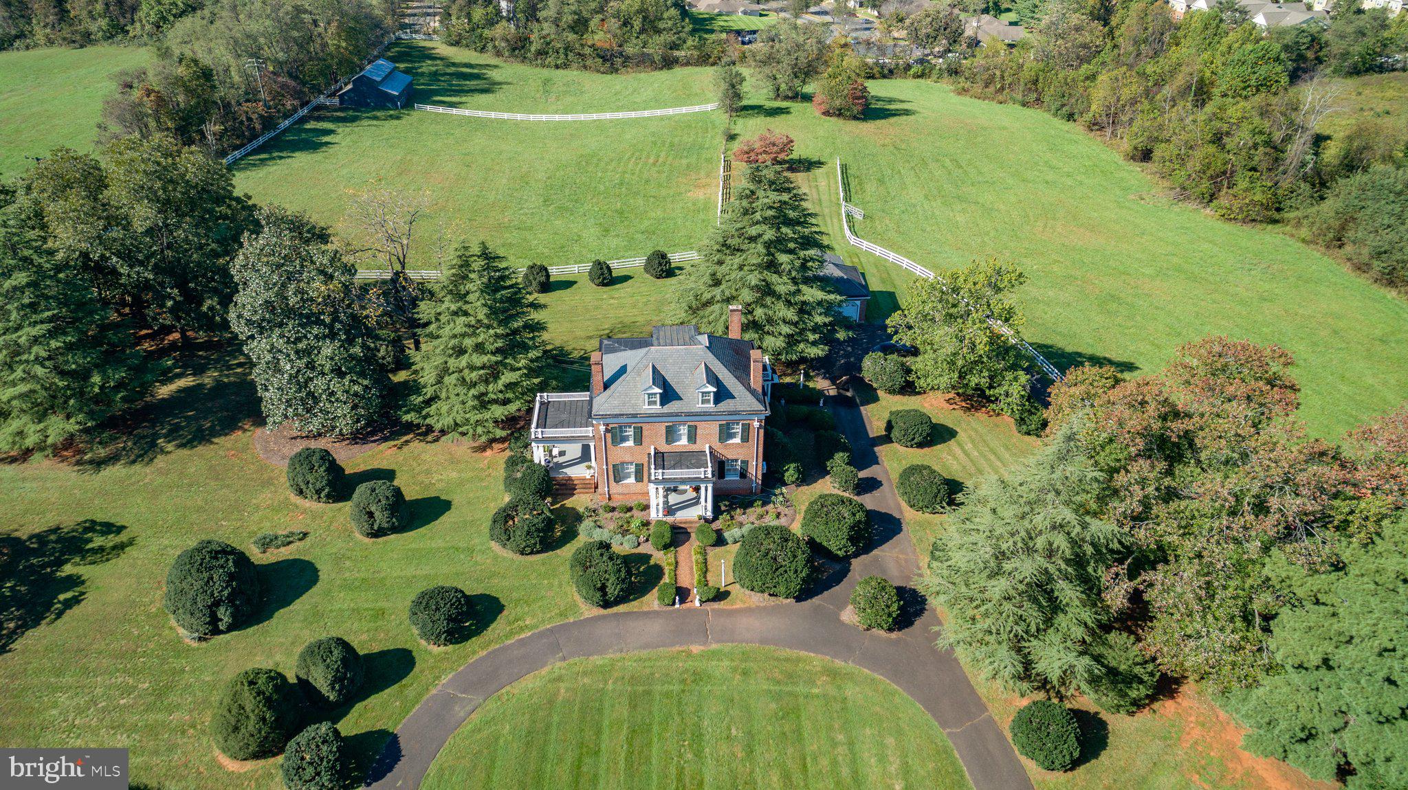 Estate-Style Residence on nearly 10 Acres in the Town of Orange

Welcome to this timeless all-brick traditional estate, offering classic elegance and modern comfort on 9 beautifully manicured acres in the heart of Orange, Virginia. This 3-bedroom, 2.5-bathroom residence showcases spacious living areas, fine architectural details, and inviting spaces both indoors and out.

A beautiful formal living room sets the tone upon entry, leading to a grand center staircase and dining room, a comfortable family room, and a well-appointed kitchen. Upstairs, you’ll find three generously sized bedrooms, a bright sunroom, and a versatile bonus room on the third floor—ideal for a home office, studio, or guest retreat. The home features two fireplaces, a basement for additional storage or future expansion, and large windows throughout that fill the home with natural light.

Enjoy outdoor living on the expansive covered porch overlooking the landscaped grounds, perfect for relaxing or entertaining. A detached 2-car garage and barn provide ample space for vehicles, hobbies, or agricultural use.

The current zoning also allows muti-family/condos by-right. 

Conveniently located within the Town of Orange, this property combines the charm of estate living with close proximity to shops, dining, and schools. Rarely does an opportunity arise to own a property of this stature, blending traditional craftsmanship with the beauty of Virginia countryside living.
