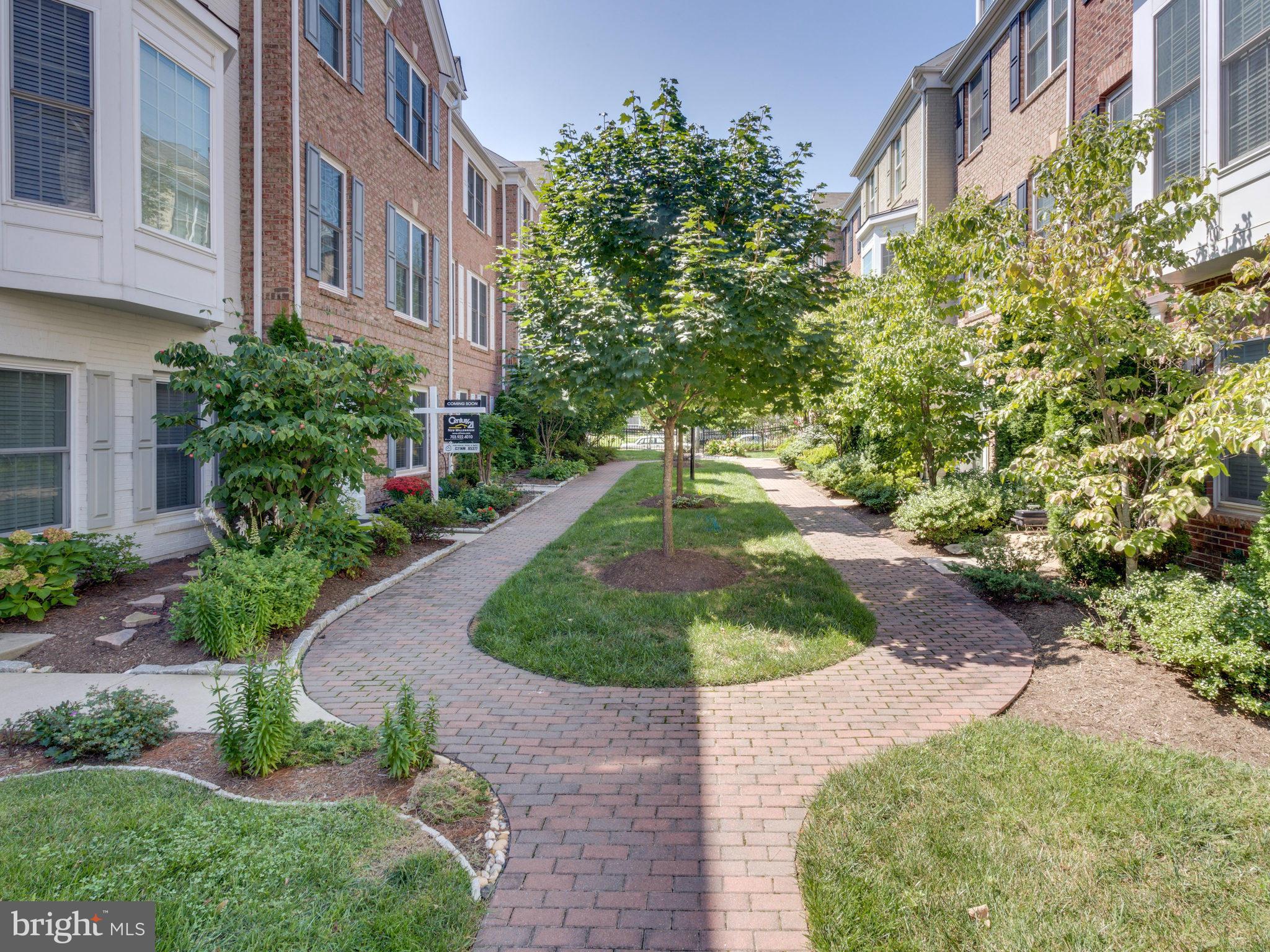 Beautiful luxury townhome 2 BLOCKS TO HUNTINGTON METRO. Two car garage, wood floors, freshly painted, cherry cabinets, granite, stainless appliances, two-sided fireplace in living/dining rooms, tray ceiling in master bedroom, master bath w/separate shower/tub,  dual sink, upgraded light fixtures throughout.  Low maintenance.Walk to park & trails. You should see this one!