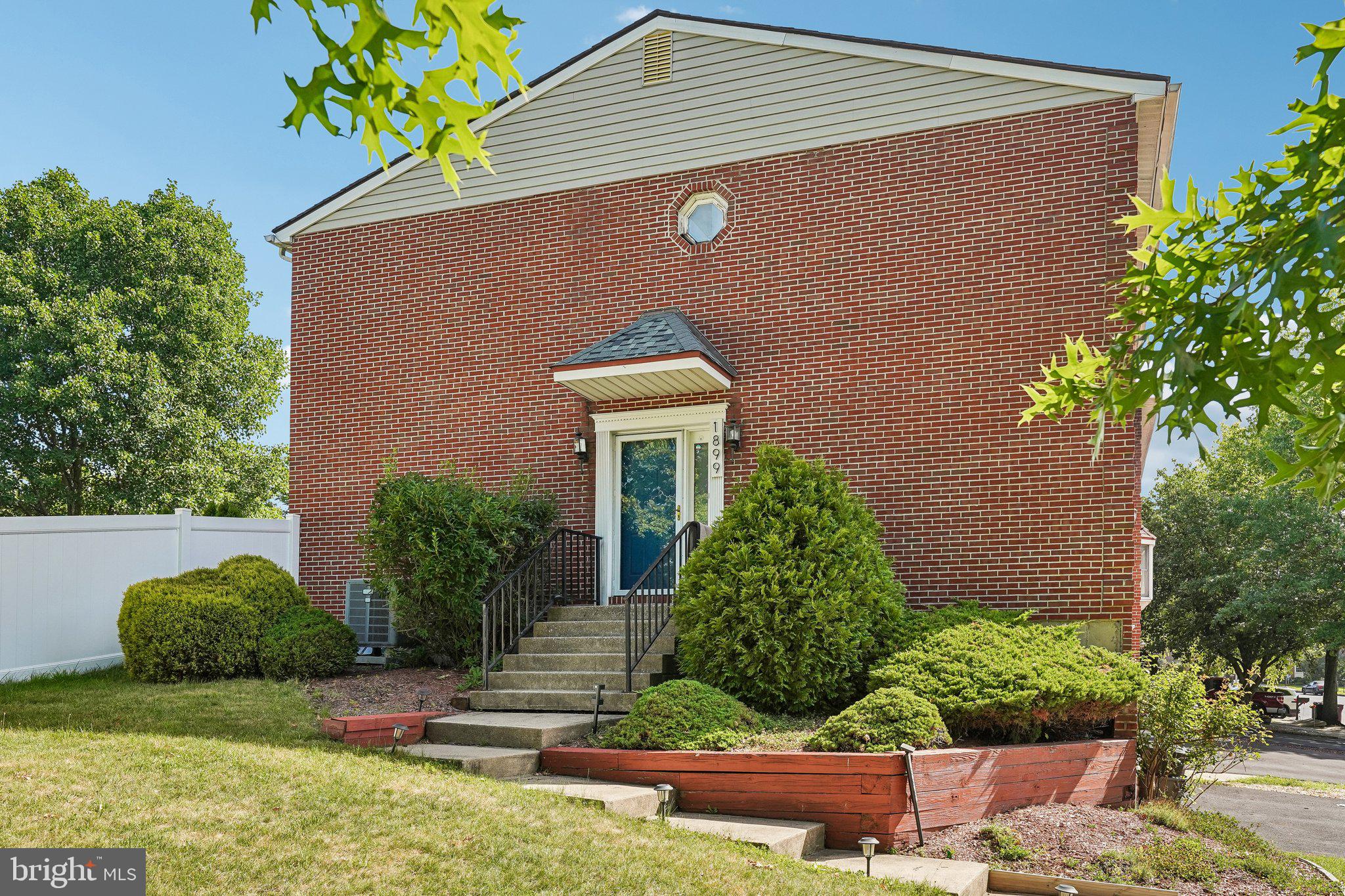 Highest and Best offers due by 7/21 @ 12 pm. Welcome to this beautifully updated end-of-row townhome in desirable Peachtree Village, perfectly situated on a large corner lot with an expansive, fully fenced backyard. A private side entrance welcomes you into the main level, where gleaming luxury vinyl plank flooring flows throughout the bright and inviting living spaces. The spacious front living room is filled with natural light from oversized windows and features a cozy wood-burning fireplace, along with a built-in bar complete with a beverage refrigerator—perfect for entertaining. The open-concept dining area flows seamlessly into the stunning, updated kitchen, showcasing stainless steel appliances, granite countertops, a striking tile backsplash, and ceiling-height wood cabinetry that provides both style and abundant storage. Sliding glass doors from the dining room lead to the rear patio and exceptionally large fenced yard, offering plenty of space for outdoor dining, gardening, pets, or play. Upstairs, you'll find three generously sized bedrooms, including the front-facing primary suite featuring dual closets and a private ensuite bath with a walk-in shower. Two additional bedrooms share a well-appointed hall bathroom with a tub/shower combination. The finished lower level offers a versatile bonus room with built-in cabinetry, making it an ideal home office, craft room, or hobby space. This level also includes the laundry area and convenient access to the attached two-car garage. Additional updates and features include a smart thermostat, water softener hookup, updated LED lighting in the living room, a repaved driveway, and a Wi-Fi-enabled garage door opener. Conveniently located just minutes from Lehigh Valley Mall, shopping, dining, parks, and major highways, this move-in-ready home offers the perfect combination of comfort, style, and convenience. Mortgage savings may be available for buyers of this listing.