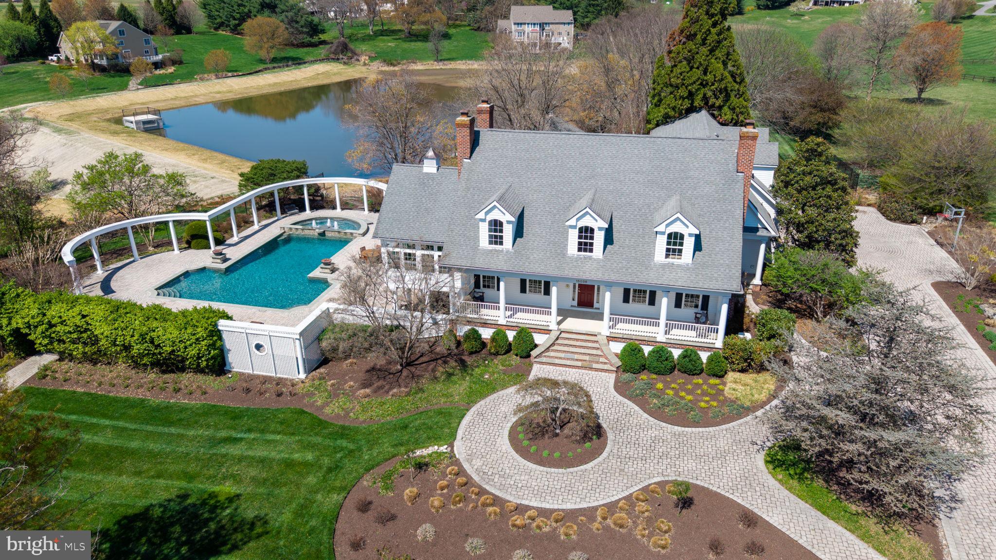 Unmatched Luxury in Western Howard County

This is a RARE opportunity to own one of Howard County’s most exclusive estates! Nestled on 5 pristine acres, this One-of-a-Kind Southern Cape Cod masterpiece redefines luxury living with 5 generously sized bedrooms, 4.5 bathrooms, and exceptional indoor-outdoor spaces that elevate every lifestyle.

From the moment you arrive, you're welcomed by award-winning landscaping, a grand concrete paver driveway, and a wide Southern-style front porch that opens to a stunning foyer wrapped in fresh 2024 designer paint and gleaming refinished cherry hardwood floors throughout.

The heart of the home continues to impress with a fully finished on-grade basement complete with its own kitchen ( perfect for in-law or guest accommodations) , a professional 9 -foot pool table, and a dedicated movie room featuring leather recliners, projector, and screen that all convey.

Outside, your private paradise awaits. The 1.5-acre, fully deeded private pond—fresh off a $1.5M reconstruction in 2024 by Howard County Contract #D-1177—is stocked with bass and ideal for your PRIVATE fishing or canoeing experience. Cascading waterfalls and a koi pond feed into the pond, creating a tranquil backdrop for everyday living or unforgettable events.

The resort-style outdoor living space features an expansive heated saltwater pool with new (2025) primary pool pump, spa, and fiber-optic lighting with adjustable colors, plus brand-new fire bowls (2025) for a truly dramatic, one of a kind nighttime experience. Entertain in style on the upper-tiered patio with a full outdoor chef’s kitchen, complete with Viking appliances, a wok, dual sinks, grill, two-burner stove, ice machine, and kegerator.

Additional outdoor highlights include:

    New whole-house generator and transfer switch ( winter 2024)

    Outdoor sound system

    Extensive low-voltage LED landscape lighting (all bulbs replaced in  fall 2024)

    Backyard walking paths and gardens

    Fenced area perfect for a playground or volleyball court

Other recent major updates:

    Primary kitchen refrigerator (2024)

    Main and basement level HVAC system replaced (2019)

    Well pump replaced (2017)

This estate is not just a home—it's a lifestyle. Located in prestigious Western Howard County, it offers unparalleled seclusion, timeless charm, and modern convenience all in one exquisite package. Whether you're hosting a grand celebration or enjoying a peaceful evening by the pond, this property is truly unmatched.

Do NOT miss this once-in-a-lifetime opportunity to own one of the finest private residences in Howard County.
Call Rebecca Mason at Cummings & Co today for your private tour!