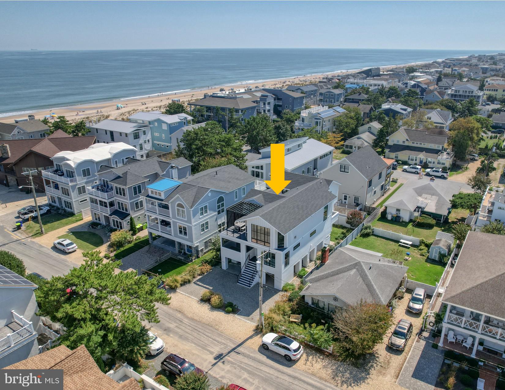 Coastal Luxury with Ocean Views & Breezes
Experience the perfect blend of luxury, comfort, and coastal charm in this stunning, professionally renovated beach retreat. Designed for effortless indoor-outdoor living, this exceptional home captures sweeping Atlantic Ocean views, refreshing sea breezes, and sophisticated designer finishes throughout.
Ideally situated on a fee simple ocean block lot in the sought-after Rehoboth by the Sea community of Dewey Beach, this remarkable residence was completely reimagined in 2020 by renowned architect Tony Beto and custom home builder Dewson. The extensive renovation included a new roof, siding, HVAC systems, decks, and beautifully redesigned interior and exterior living spaces.
The welcoming foyer opens to a spacious first level featuring four generously sized bedrooms, including three private ensuite bedrooms. This level also offers a large laundry room complete with a built-in dog washing station, a convenient powder room, elevator access, and two outdoor living areas designed for gathering, relaxing, and enjoying the coastal lifestyle.
Upstairs, the open-concept living space is both elegant and inviting. The gourmet kitchen, complete with high-end appliances and an oversized walk-in pantry, flows seamlessly into the dining area and spacious great room. A cozy fireplace anchors the space, while sliding glass doors lead to a covered deck with a pergola and panoramic ocean views—creating the perfect setting for entertaining or simply unwinding by the sea.
The luxurious owner's suite is a private sanctuary featuring its own deck, a double-sided fireplace, and a spa-inspired bath with a soaking tub, oversized tiled shower, dual vanities, and a private water closet.
The ground level offers a spacious garage with coated floors, abundant storage, an outdoor shower, and a private fenced backyard—ideal for pets, outdoor enjoyment, or quiet relaxation after a day at the beach.
Every detail of this home reflects exceptional craftsmanship and thoughtful design. Highlights include cathedral ceilings, hardwood flooring, custom millwork, shiplap accents, wainscoting, designer wallpaper, exquisite tilework, on-demand hot water, central vacuum, an elevator, and premium finishes throughout.
Professionally furnished and offered move-in ready, this extraordinary coastal home is equally suited as a full-time residence, luxurious vacation retreat, or exceptional investment property with strong rental potential.
Schedule your private showing or take the video tour to experience this extraordinary ocean-block retreat for yourself.