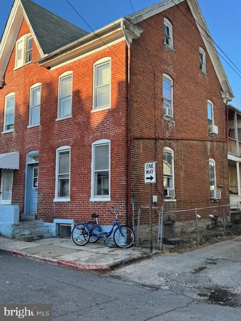 GREAT INVESTMENT OPPORTUNITY!  Great price on this solid all brick half-double on corner lot in south Hagerstown within walking distance to City Park, Meritus Park, and downtown Hagerstown.  3 BR, 1 BA, full walkup attic which provides potential for additional living space. Wood flooring throughout, and some windows updated. Natural gas heat, updated electric.    Sold strictly AS IS.