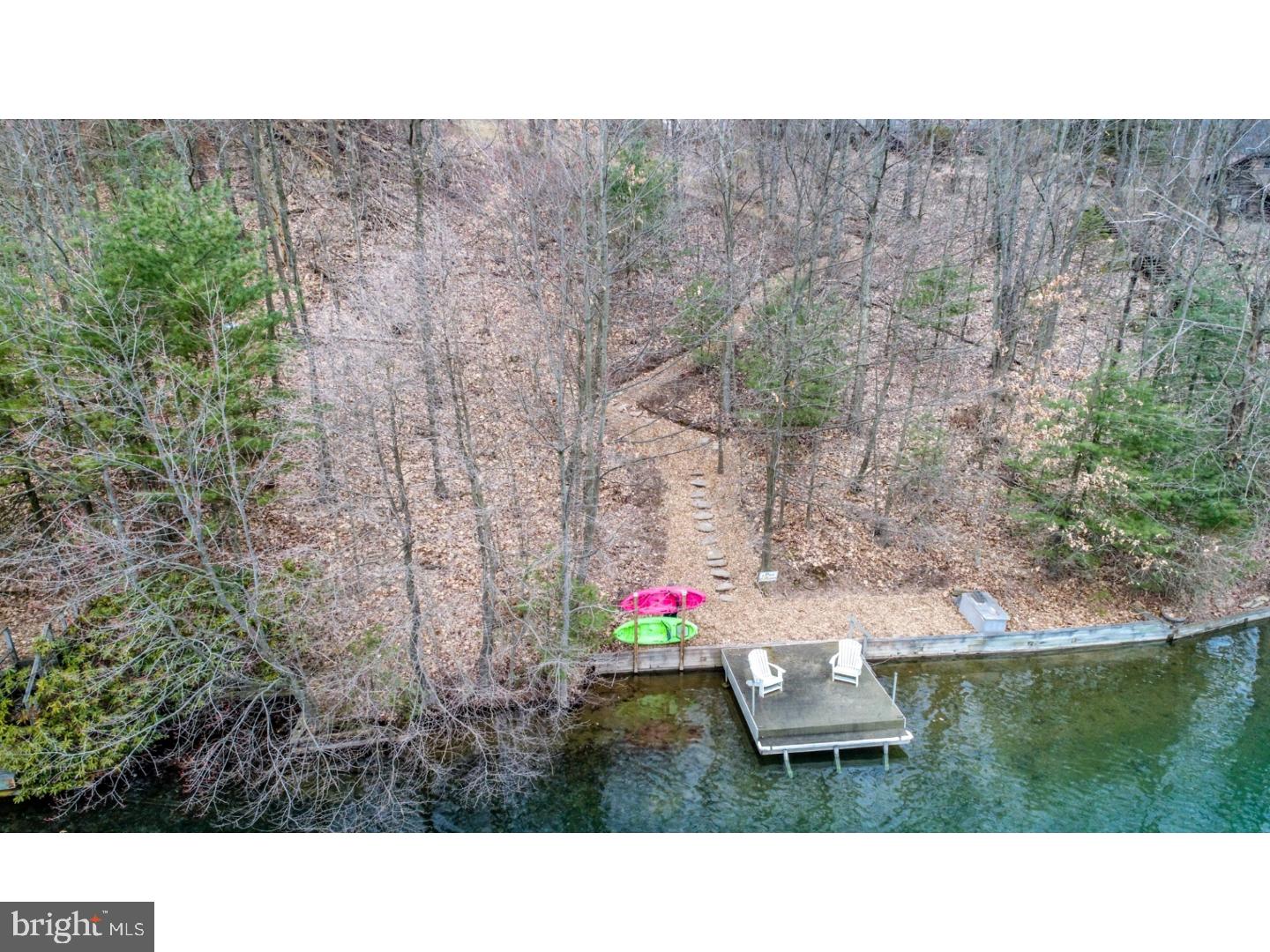 One of the few premier Lake Wynonah lakefront building lots still available! 664 Apache Cove is a perc approved parcel with a beautiful and inviting space for your personalized lakefront home. From the spacious open area above, stroll down through the trees to your dock and waterfront; pathway to lake is a gentle switchback naturally adorned with wood chips. Waterfront is located in a no-wake zone and boasts beautiful views of the lake. A truly desirable and serene piece of property! Perc Test results and Survey available.  Lake Wynonah is a gated lake community, featuring 2 gorgeous, pristine freshwater lakes. Amenities include: business office/gathering room/library, lodge w/dining and bar, social clubs, boating, fishing, wakeboarding, waterskiing, tubing, paddleboarding, tennis, pickleball, several parks/pavillion, shuffleboard, newer basketball courts, horseshoe pits, 2 pools, beautiful docks, hiking, natural wildlife and marina. Groups and events include: Civic Association, Dances/Concerts, Book, Lodge and Pinochle Groups, Volunteer Programs, Fish & Boat Group, Exercise Classes. Located less than an hour from Allentown, Harrisburg and Reading, BEAT THE BEACH TRAFFIC and settle in at the lake!