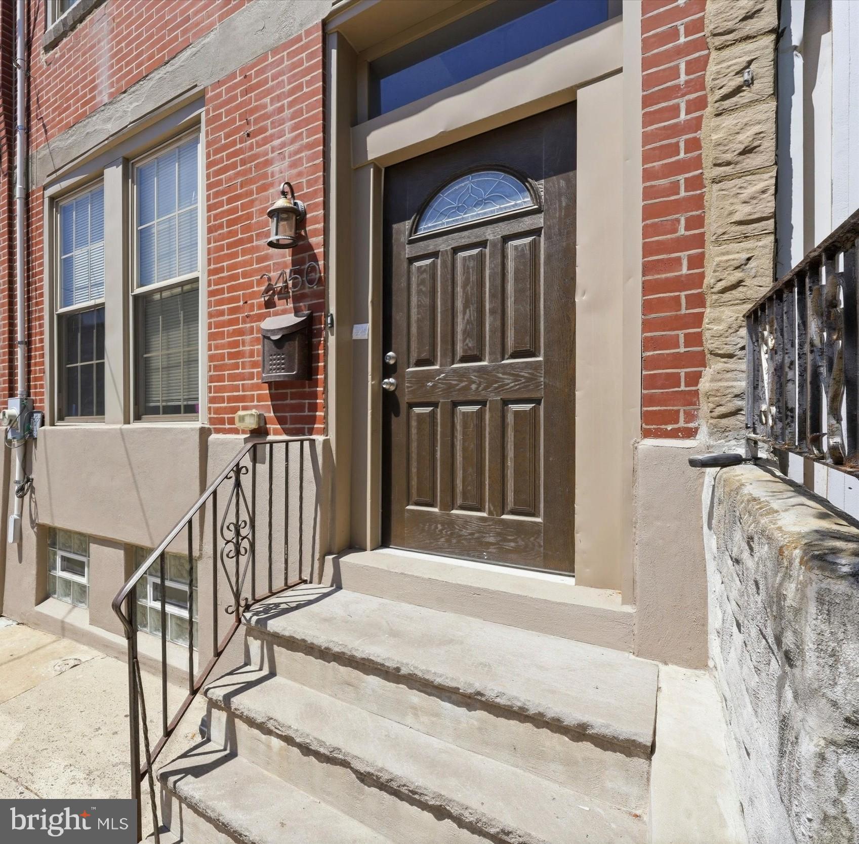 Welcome to 2450 N. 20th St—an updated 3-story Philadelphia home offering 5 bedrooms, 3.5 bathrooms, and a flexible layout. The main level features an open living and dining area with engineered hardwood floors, tray ceilings, recessed lighting, modern handrails, updated light fixtures, ceiling fans, and a brand-new electric stone fireplace. The kitchen includes brand-new appliances and a clean, functional layout for everyday use and entertainment. The 2nd floor offers the primary bedroom which includes an ensuite bath with a separate shower and tub; 2 additional bedrooms and a full bathroom, while the 3rd floor adds 2 additional bedrooms and another full bathroom. The home features generous room sizes, a large rear yard with outdoor potential and washer and dryer hookups in the finished basement. Priced to sell, this move-in-ready property offers modern updates, and strong value.