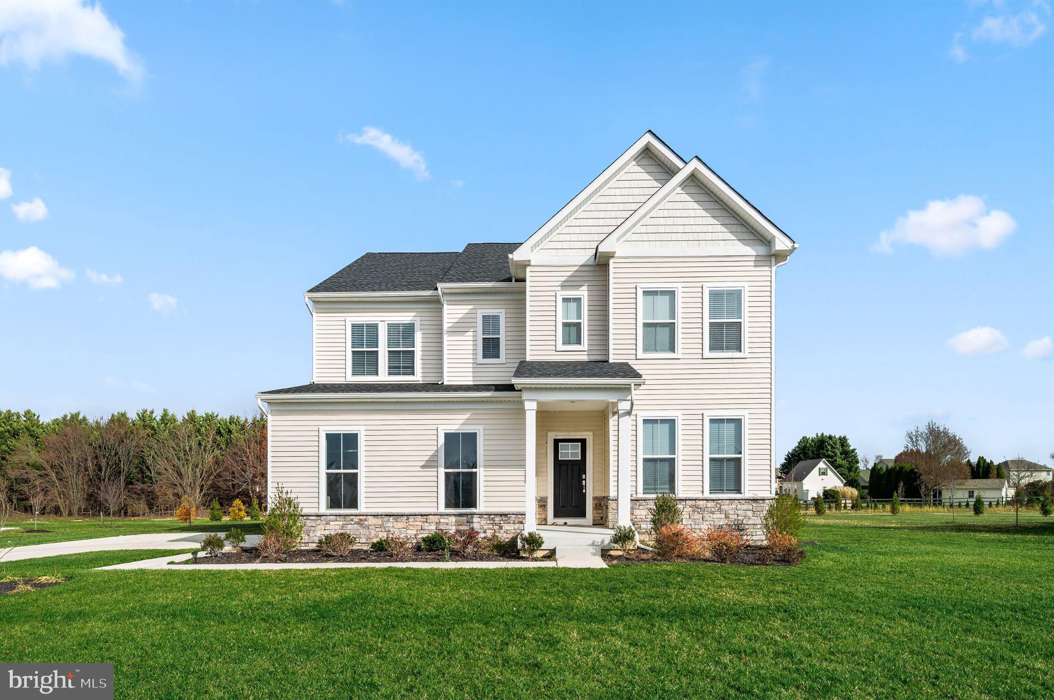 The long-awaited final release at The Colony has arrived! Don't miss your opportunity to own one of just seven remaining homes in the highly anticipated reopening of this sought-after Bear community. Ideally situated north of the C&D Canal off Route 896 and within the top-ranked Appoquinimink School District, The Colony offers an exceptional location with convenient access to shopping, dining, recreation, and major commuter routes. Even better, this home is available for a Fall 2026 move-in, allowing you to enjoy new construction without the extended wait.

Welcome to 127 Hammersmith Drive, perfectly positioned on a premium homesite that backs to expansive open space, providing peaceful views and added privacy rarely found in new construction. Whether enjoying your morning coffee or unwinding at the end of the day, the backyard setting creates a beautiful backdrop for everyday living.

Inside, a welcoming foyer leads to a bright and versatile flex room, offering endless possibilities as a home office, formal living room, playroom, or hobby space. The open-concept design creates an effortless flow between the gourmet kitchen, dining area, and spacious great room, making it ideal for both entertaining and everyday life.

The thoughtfully designed kitchen showcases 42-inch cabinetry, quartz countertops, stainless steel appliances, a large center island, and wide-plank flooring throughout the entire main living area. A fireplace anchors the great room, adding warmth and character to the home's central gathering space. A first-floor bedroom with an adjacent full bath provides outstanding flexibility for overnight guests, multi-generational living, or a private workspace.

Upstairs, the spacious primary suite offers a relaxing retreat with abundant natural light, a generous walk-in closet, and a beautifully appointed en suite bath. Three additional generously sized bedrooms provide room for everyone, including one oversized bedroom with an impressive walk-in closet. A centrally located full bath and convenient second-floor laundry room complete the upper level.

The finished basement expands your living space with a large recreation room perfect for entertaining, relaxing, or creating a home gym or media room. An additional full bathroom and abundant unfinished storage ensure you'll have space for everything from seasonal décor to hobbies and future needs.

With its premium homesite backing to scenic open space, designer finishes, flexible floorplan, and unbeatable location, 127 Hammersmith Drive represents one of the final opportunities to own in The Colony. Only seven homes remain in this long-awaited final release, and demand is expected to be strong. Schedule your private tour today and secure your new home before these limited opportunities are gone.

*Pictures are of similar home from a different community.
**Appointments held at nearby community, Freestone Village in Middletown. Similar model available to tour in Magnolia, DE - at our Chaselynd Hills community.