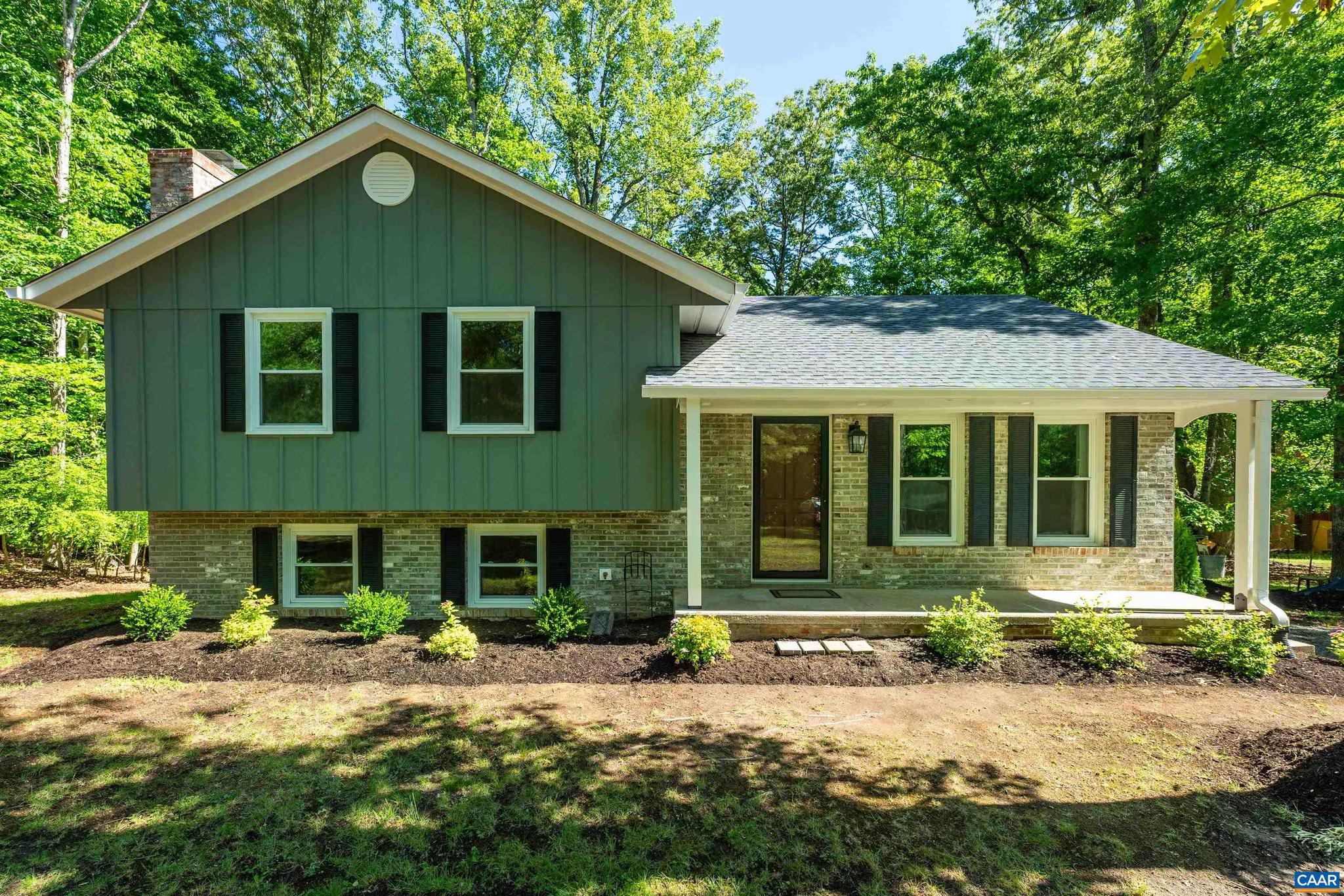 Beautifully updated split-level home in the desirable Terrybrook neighborhood, conveniently located just minutes from Hollymead Town Center and NGIC. Tucked away on a quiet cul-de-sac and elevated above the road, this inviting property offers excellent curb appeal with a freshly painted exterior and welcoming front porch. Extensively renovated throughout, this move-in-ready home features a new roof, new windows, brand-new kitchen, and comprehensive interior updates. The main level offers a spacious living room and easy access to the new rear deck overlooking the private backyard. All 3 bedrooms are located upstairs, including a primary suite with private bath. The walkout lower level features a large family room with cozy wood-burning fireplace, an additional full bathroom, and laundry room complete with new washer and dryer. Additional improvements include extensive tree work and landscaping to open up the yard, plus a recently serviced septic system with a new distribution box installed and a clean bill of health. Set on a peaceful 1-acre lot in a sought-after Albemarle County neighborhood, this turnkey property offers privacy, convenience, and modern updates throughout.,Granite Counter,White Cabinets,Fireplace in Basement