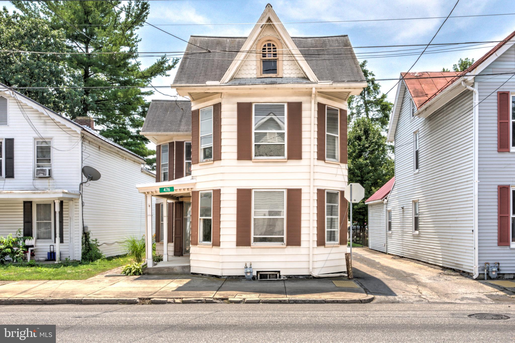 Welcome home to this charming 3-bedroom, 1.5-bath traditional home in the heart of Chambersburg, where timeless character meets fresh updates. Thoughtfully refreshed with new flooring, paint, and light fixtures throughout, this home is move-in ready for its next owners. The spacious main living areas offer excellent flow and are filled with classic charm, featuring large bay windows, beautiful original built-ins, and plenty of room to gather or entertain. A convenient first-floor powder room adds everyday functionality for family and guests alike. An elegant staircase leads to the second level, where you'll find three generously sized bedrooms with refinished hardwood floors, including one with an adjoining sitting room or dressing area that adds flexibility and character. The spacious full bathroom features a walk-in shower, while the attic and unfinished basement provide abundant storage. Outside, enjoy the large, usable backyard along with the convenience of off-street parking at the rear of the property. If you've been searching for a home that combines historic charm, generous living space, and tasteful updates in a convenient central Chambersburg location, this is one you won't want to miss!