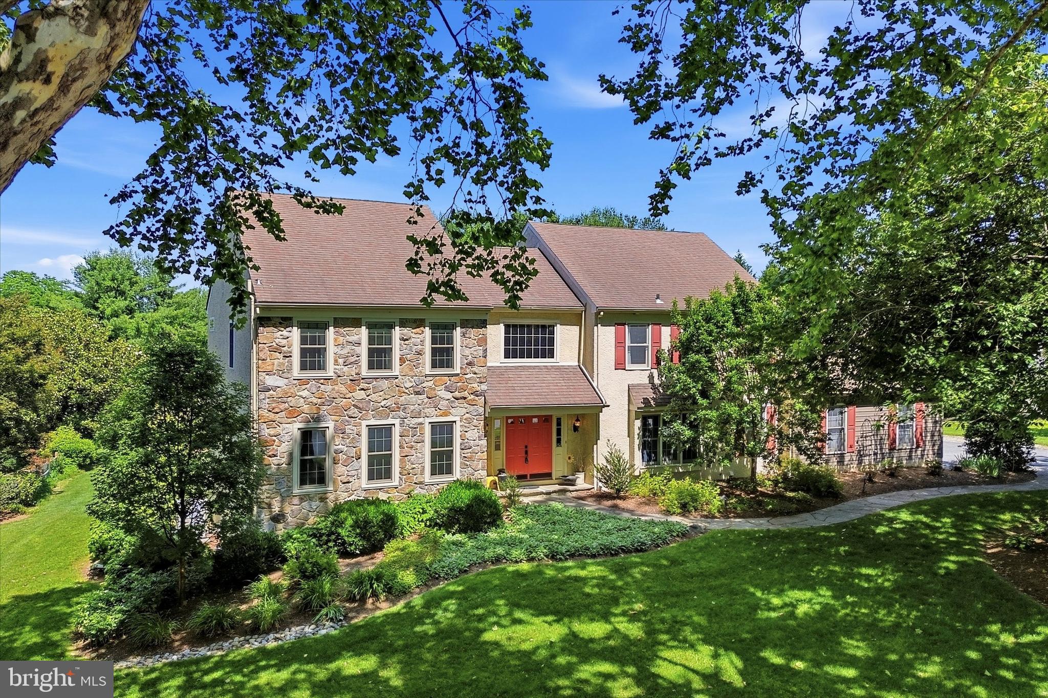 Tucked along a quiet street on a level lot backing to HOA-owned and maintained open space, this beautifully updated Kirkbrae Road colonial delivers the rare combination of refined living and true privacy — all in one of Chester County's most coveted settings, minutes from the iconic Longwood Gardens and the Kennett Square Golf & Country Club.
The heart of the home is a stunning open-concept kitchen and family room designed for both everyday living and effortless entertaining. The chef's kitchen showcases quartz countertops, a subway tile backsplash, stainless appliances, and an amazing contrasting-color island, with sliding glass doors opening directly to the private deck overlooking the serene backyard. The family room anchors the space with a dramatic gas fireplace framed in heavy stone with a solid beam mantle. A spacious formal dining room, generous living room, bonus study, laundry/mudroom, and powder room round out a remarkably functional main level.
Upstairs, the expansive primary suite is a true retreat, featuring a spa-caliber bath with a grand doorless shower, double vanity, and skylight. Three additional generously sized bedrooms and a full hall bath complete the upper level.
The finished walk-out lower level adds versatile living space and flows seamlessly to a private stone patio with hot tub — your own backyard sanctuary. An oversized three-car garage and the peaceful open-space backdrop make this home as practical as it is beautiful.
Well maintained with a Generac whole house generator.  Easy commutes to Wilmington and West Chester, and just minutes from the vibrant dining, culture, and community of Kennett Square. This is the move-up home you've been waiting for.