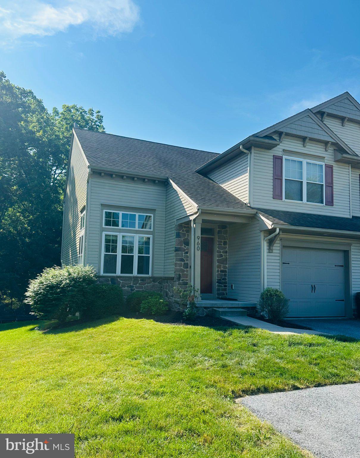 Discover the perfect blend of comfort and style in this stunning semi-detached home, built in 2012 and designed with a traditional flair. Spanning over 2,060 sq ft this residence features three spacious bedrooms and two and a half bathrooms, providing ample space for relaxation and entertaining. Step inside to find a warm and inviting atmosphere, highlighted by beautiful hardwood and new plush carpet flooring. The heart of the home is the gourmet kitchen, complete with a central island, perfect for casual dining or meal prep. Enjoy the convenience of new modern appliances, large granite island and ample cabinetry making everyday tasks a breeze. The dining area flows seamlessly into the kitchen great for entertaining. The large 2 story great room features a cozy fireplace and vaulted ceilings creating an ideal setting for gatherings or relaxing evenings at home. Venture outside to your private outdoor oasis, featuring a deck and patio, perfect for summer barbecues or morning coffee. The creek in the rear is sure to be hit with all ages! The finished walkout basement offers additional living space, ideal for a home office, playroom, or entertainment area. With an attached front-entry garage and oversized driveway, parking is both convenient and accessible. Set on a generous .25 acre lot, this home provides a sense of space and tranquility. Enjoy the benefits of no association fees and the freedom to personalize your outdoor space. This property is not just a house; it's a place to create lasting memories. Don't miss the opportunity to make it yours!