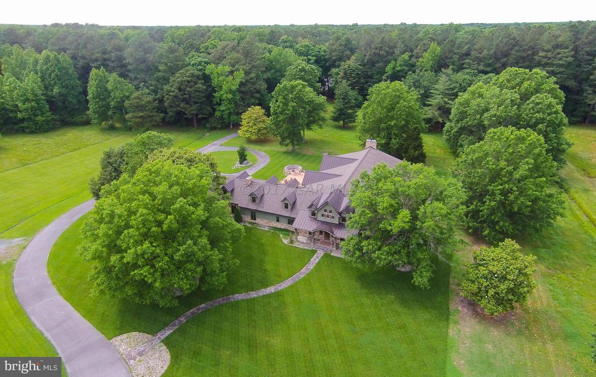 This one of a kind 219 Acre Shore Estate is truly designed with its attention to detail and located within minutes from the Atlantic Ocean and the Chesapeake Bay.  Conveniently located to the Salisbury Airport.  There's over 7500 sq. ft. plus a 4500 sq.ft. walk out finished basement. This home features two bedrooms on the first floor and two bedrooms on the second floor plus a bonus room with a closet, five bathrooms and two half baths.  Gourmet kitchen, three fireplaces and GEO Thermal Heat.  Basement -level features movie room and even an archery practice range!  Two walk-in safes and bullet-proof glass gun showcases.  There's a stocked pond with feeder and this is truly a hunters paradise.