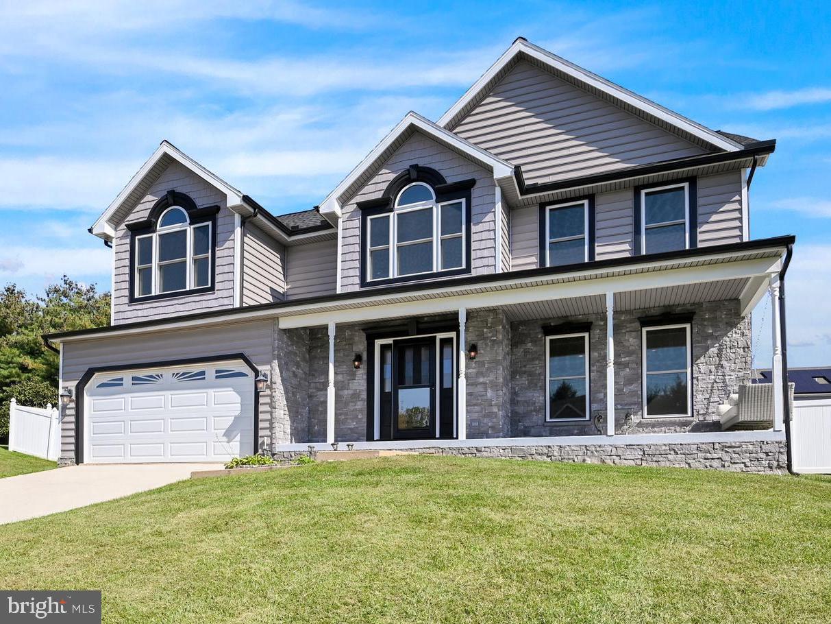 Wonderful colonial, situated on a large, fenced lot in Stewartstown!  Just a short drive to I83 and the PA/MD line!  The exterior of this home home received a complete makeover in 2019, to include a new architectural roof, energy efficient windows, gutters, siding, stone facade and so much more! Entering the home, you are welcomed into the two-story foyer with wood floors and angled staircase.  Moving throughout the main level, you will notice the stunning luxury vinyl plank flooring.  With today’s busy lifestyles, it is easy to maintain, always looks good and is durable. The kitchen features elegant accents such gorgeous quartz worktops, matte back hardware, and painted white cabinets. The dining room provides ample space for a sizable dining table and boasts a large bay window!  The ideal location to organize a dinner party for family and friends! It also opens to the front living room where guests can retire for cozy chat. Off the kitchen, there is a spacious family room with a fireplace, recessed lighting and a sliding door to the maintenance free deck.  All of these spaces make for great entertaining opportunities! Also conveniently located on the 1st floor, is a powder room and a spacious laundry room.  On the second level, there is a sizable principal bedroom featuring a huge walk-in closet and an adjacent bathroom with double vanities, an expansive soaking tub, and a private water closet!  Down the hall, there are 3 more bedrooms and another full bath.  Back downstairs, the unfinished lower level provides plenty of storage or room for further expansion!  Outside, there is a 30' Doughboy pool and pirate ship playset which will provide hours of outdoor fun!  Other additional features include a 2-car garage plus a shed for storing lawn and pool equipment!  This home is ready for it’s next story!  Let it be yours!  Schedule your own private tour today!