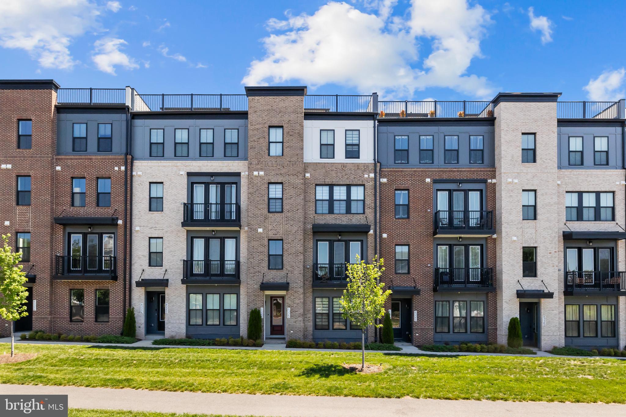 Welcome to Demott Silver, one of Broadlands’ newest and most desirable communities! Built in 2024, this beautifully designed four-level townhome-style condominium offers over 2,200 square feet of modern living space with the perfect blend of style, comfort, and low-maintenance convenience. The open-concept main level is filled with natural light and features a spacious great room that flows seamlessly into a stunning kitchen with quartz countertops, upgraded cabinetry, stainless steel appliances, tile backsplash, a large center island, and pantry storage—ideal for everyday living and entertaining. Upstairs, the luxurious primary suite provides a private retreat with a walk-in closet and spa-inspired bath featuring dual vanities, a soaking tub, and an oversized shower. Two additional bedrooms and a full bath offer flexibility for family, guests, or a home office. The entry level includes a welcoming foyer, mudroom, and direct access to the attached one-car garage. Enjoy outdoor living from the private balcony and take advantage of exceptional community amenities, including pools, fitness facilities, playgrounds, tennis and pickleball courts, walking trails, and more. Conveniently located just minutes from the Silver Line Metro, major commuter routes, shopping, dining, and Dulles Airport, this nearly new home offers the perfect combination of modern design, energy efficiency, and an unbeatable Broadlands location.