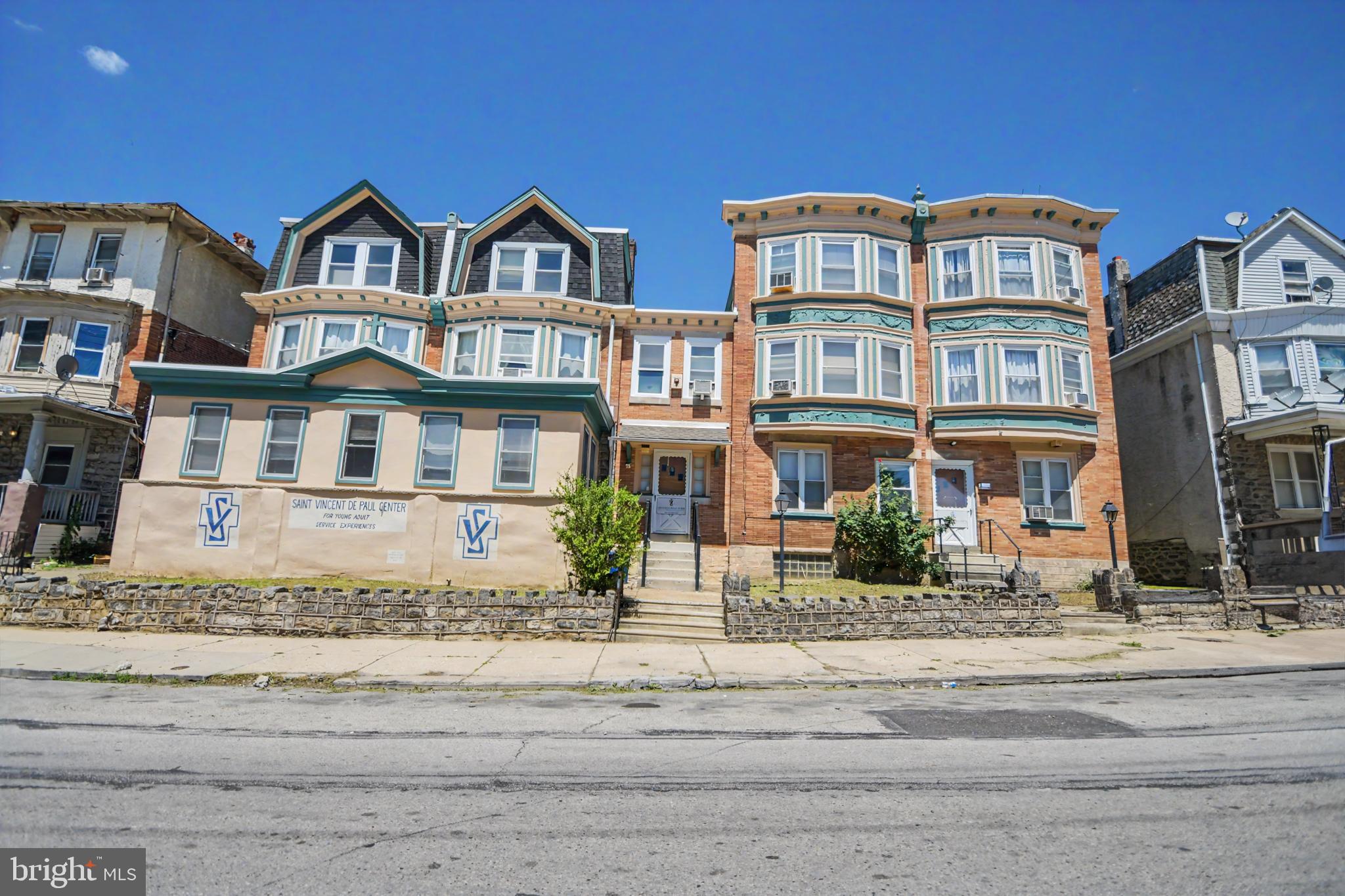 Incredible Space, Endless Potential: A 9,400+ SQ FT Unique Gem in Germantown. Rarely
does an opportunity of this scale and versatility present itself in the historic Germantown section
of Philadelphia, situated just one mile from LaSalle University with effortless access to major
transit hubs. This massive 9,482-square-foot building—previously utilized as a peaceful convent
and a vibrant community youth center—offers an expansive layout where the original two left
twin homes have been thoughtfully merged to function as one cohesive structure, complete with
a central common staircase leading seamlessly to all three floors. The other two twin buildings
are connected on the main floor and offer additional meeting, bedroom and office space.
Boasting an impressive 25 bedrooms (mostly single rooms), 2 large kitchens engineered
for group meal prep and attached dining areas, a dedicated laundry/sorting room, abundant
communal spaces, and a rare, secure walled-in rear yard, the property provides a true unique
footprint for high-capacity housing, institutional use, or creative redevelopment. Adding
immediate value to the transition, the property conveys with personal property including
single-family/twin beds, mattresses, select bedding, various sitting chairs, dining tables, and
side tables, offering an unmatched architectural blueprint and solid operational foundation in a
highly accessible Northwest Philadelphia location.