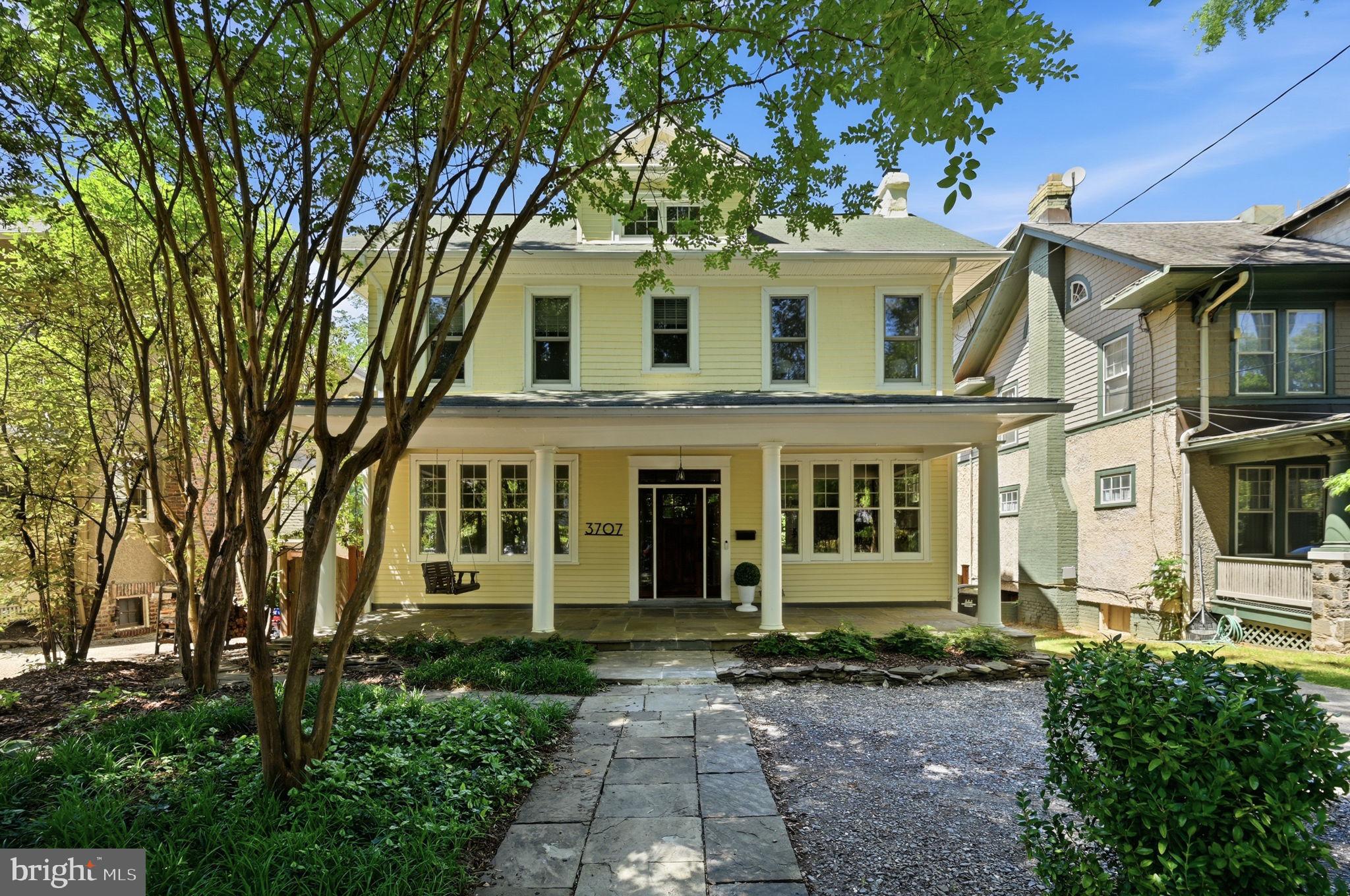 Stately and timeless, this Craftsman four-square porch-front home blends classic 1917 charm with thoughtfully designed spaces for modern living. From the welcoming front porch to the expansive interior, every detail invites you in.

A grand foyer sets the tone, leading to gracious living and dining rooms anchored by original character and natural light. The custom-designed eat-in kitchen has been beautifully renovated with upscale finishes, generous workspace, and a walk-in pantry, and powder room, flowing seamlessly into a stunning treehouse-like family room overlooking the backyard. A private office/library on this main level offers the perfect work-from-home retreat, while an elegant open back staircase connects to the lower level.

Upstairs, the bedroom level features a spacious primary suite with a sitting area and en-suite bath, along with three additional bedrooms, an updated hall bath, and a convenient laundry room. A storage closet on this level is already plumbed for an additional bath, offering future flexibility.

The finished attic provides a charming au-pair or guest suite complete with bedroom, renovated full bath, and ample storage.

The fully renovated walk-out lower level offers exceptional versatility, featuring a recreation room ideal for movie nights or play, a bright studio or office, an additional bedroom, and a full bath—perfect for guests or extended living.

In total, the home offers six bedrooms, four and a half baths (with potential for a fifth), multiple living spaces, and room to grow. Outside, enjoy a deep, expansive lot with a beautiful backyard, plus the convenience of off-street parking.

Ideally located with easy access to Metro, schools, shops, and neighborhood favorites, this home truly offers the best of space, character, and location—an exceptional opportunity to have it all.