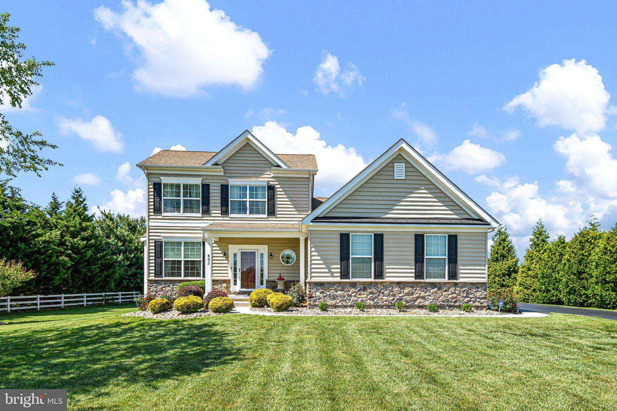 Welcome to the premier community of St. Georges Crossing, ideally perched just above the C&D Canal—where elegance, space, and convenience come together in perfect harmony. This exceptional 3,225 sq. ft. detached residence offers a thoughtfully designed layout highlighted by a luxurious first-floor primary suite, complete with a spa-inspired four-piece bath—your private retreat at the end of each day. Upstairs, you’ll find two generously sized bedrooms, a full bath, and an inviting loft—perfect for relaxation, work, or play. The fully finished lower level elevates the home’s lifestyle appeal, featuring a custom wet bar, a flexible office or guest bedroom, an additional tiled full bath, and an expansive recreation area. Movie nights become an experience in your very own home theater with stadium seating. At the heart of the home, a chef’s kitchen impresses with double ovens, a gas range, and abundant space for gathering and entertaining. Formal living and dining rooms provide timeless elegance, while the sunroom and breakfast nook offer light-filled spaces for everyday living. Throughout the home, you’ll appreciate 9-foot ceilings, a neutral designer palette, and luxury upgrades that create a seamless blend of sophistication and comfort. Step outside to a massive, maintenance-free Trex deck overlooking a sprawling ¾-acre homesite—an ideal setting for entertaining or simply enjoying peaceful outdoor living. The exterior is equally impressive, featuring a side-entry oversized two-car garage with overhead storage, complemented by meticulously maintained landscaping. Perfectly positioned for today’s lifestyle, this home offers effortless access to Route 1 and I-95, making commuting to Wilmington, Newark, Philadelphia, and the Christiana area a breeze. Travel south and you’re just minutes from Smyrna, Dover, and Delaware’s beautiful beaches and outlet shopping. Enjoy nearby parks, scenic walking trails, and charming historic destinations including Old New Castle, Delaware City, and Chesapeake City. With convenient access to schools, shopping, dining, and local attractions like Blue Rocks baseball, this location delivers both tranquility and connectivity. This is more than a home—it’s a lifestyle defined by comfort, elegance, and exceptional living.
