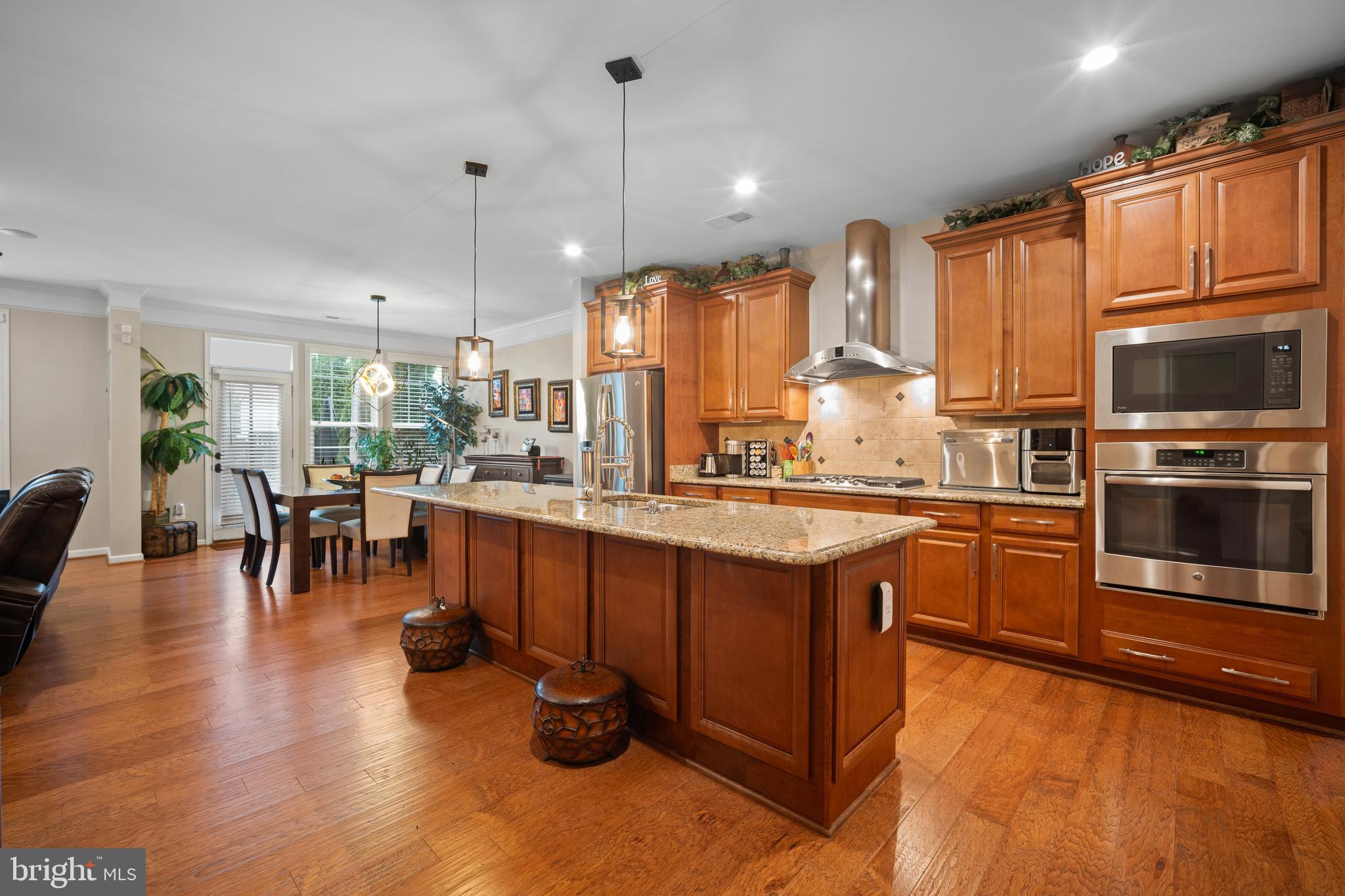 ATTENTION BUYERS: CUT YOUR MONTHLY PAYMENT IN HALF! This stunning Stone Ridge luxury townhome features a rare, 2.5% INTEREST RATE VA ASSUMABLE LOAN open to BOTH Veteran and NON-VETERAN buyers (subject to VA assumption approval). Why pay today's high market interest rates when you can save every month on your mortgage?

Welcome home to this beautiful, inviting retreat nestled right in the heart of Stone Ridge! From the moment you step inside, you will instantly feel at ease in this lovely 2,633-square-foot haven. Built in 2014, it is perfectly designed to wrap you in pure comfort while still feeling bright, open, and effortlessly elegant.

The true heart of the home features a cozy fireplace, making the main living area the ultimate spot to unwind after a long day or cuddle up with loved ones. You will love how the open floor plan beautifully connects the living, dining, and kitchen areas, allowing conversations to flow easily whether you are cooking dinner or hosting friends. As a wonderful bonus, the main level includes a spacious, flex space just waiting for your imagination—perfect for a quiet home office, a playful game room, or a creative studio! Throughout the home, high-end finishes add a touch of luxury while keeping upkeep to a absolute minimum, giving you more time to simply relax and enjoy life.
Every corner of this property is filled with thoughtful details tailored for modern living. Massive windows flood the rooms with cheerful natural light, creating an airy, uplifting atmosphere that is ready for your personal touch. Step outside to discover your own private getaway on the lovely paver patio. Imagine starting your mornings sipping coffee surrounded by peaceful greenery, or hosting relaxed evening gatherings under a canopy of stars.
Getting around is an absolute breeze, too! You are just a stone's throw away from Stone Springs Hospital, fantastic shopping, grocery stores, local restaurants, and the public library. Plus, with commuter lots under 5 miles away and Dulles International Airport less than 10 miles from your door, keeping life moving smoothly is effortless. Best of all, you are joining a vibrant, friendly neighborhood with a thriving community spirit. This isn't just a house; it’s a place where your favorite memories will be made. Come see it for yourself—your everyday retreat is waiting!