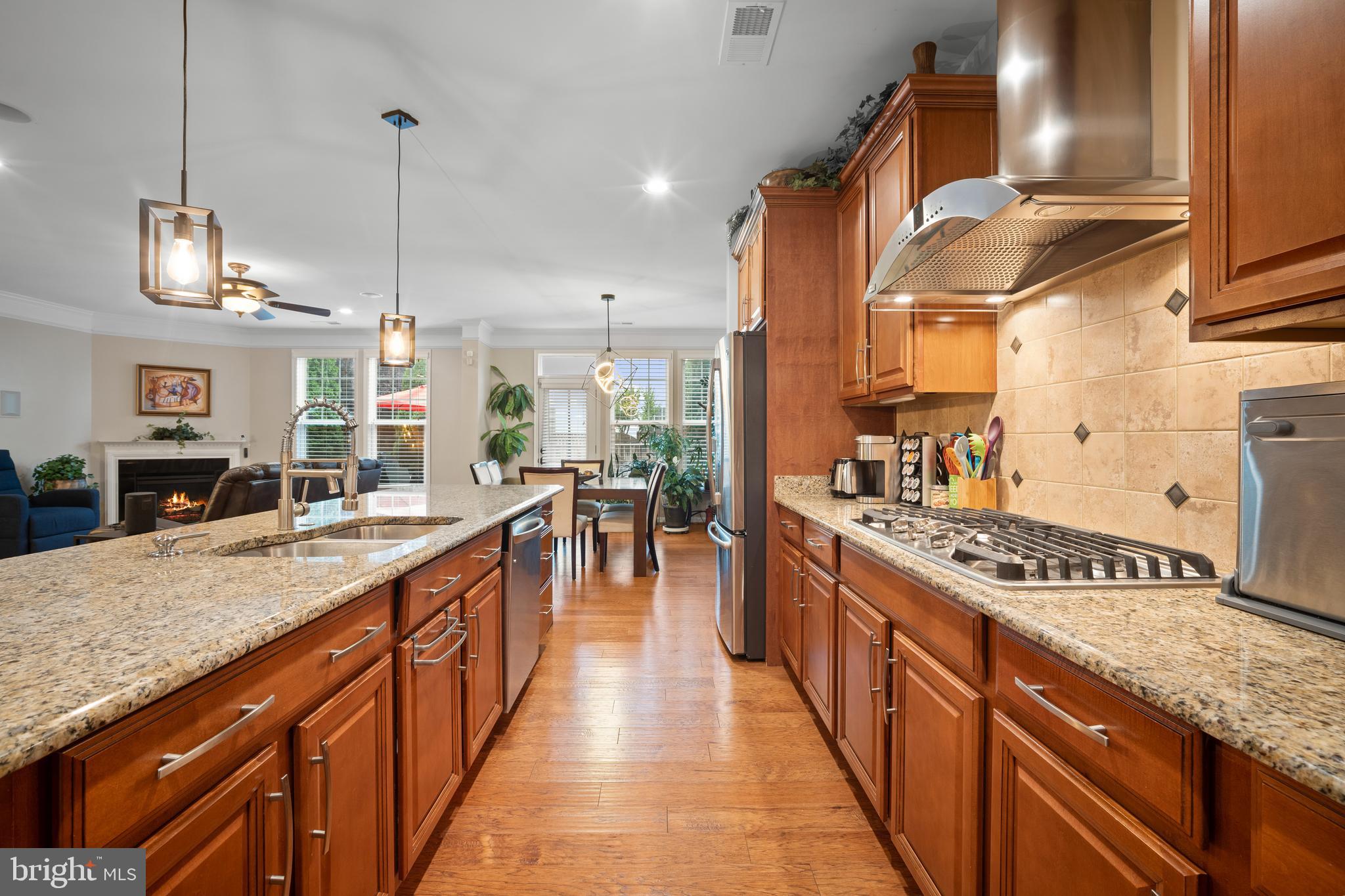 ATTENTION BUYERS: CUT YOUR MONTHLY PAYMENT IN HALF! This stunning Stone Ridge luxury townhome features a rare, 2.5% INTEREST RATE VA ASSUMABLE LOAN open to BOTH Veteran and NON-VETERAN buyers (subject to VA assumption approval). Why pay today's high market interest rates when you can save every month on your mortgage?

Welcome home to this beautiful, inviting retreat nestled right in the heart of Stone Ridge! From the moment you step inside, you will instantly feel at ease in this lovely 2,633-square-foot haven. Built in 2014, it is perfectly designed to wrap you in pure comfort while still feeling bright, open, and effortlessly elegant.

The true heart of the home features a cozy fireplace, making the main living area the ultimate spot to unwind after a long day or cuddle up with loved ones. You will love how the open floor plan beautifully connects the living, dining, and kitchen areas, allowing conversations to flow easily whether you are cooking dinner or hosting friends. As a wonderful bonus, the main level includes a spacious, flex space just waiting for your imagination—perfect for a quiet home office, a playful game room, or a creative studio! Throughout the home, high-end finishes add a touch of luxury while keeping upkeep to a absolute minimum, giving you more time to simply relax and enjoy life.
Every corner of this property is filled with thoughtful details tailored for modern living. Massive windows flood the rooms with cheerful natural light, creating an airy, uplifting atmosphere that is ready for your personal touch. Step outside to discover your own private getaway on the lovely paver patio. Imagine starting your mornings sipping coffee surrounded by peaceful greenery, or hosting relaxed evening gatherings under a canopy of stars.
Getting around is an absolute breeze, too! You are just a stone's throw away from Stone Springs Hospital, fantastic shopping, grocery stores, local restaurants, and the public library. Plus, with commuter lots under 5 miles away and Dulles International Airport less than 10 miles from your door, keeping life moving smoothly is effortless. Best of all, you are joining a vibrant, friendly neighborhood with a thriving community spirit. This isn't just a house; it’s a place where your favorite memories will be made. Come see it for yourself—your everyday retreat is waiting!
