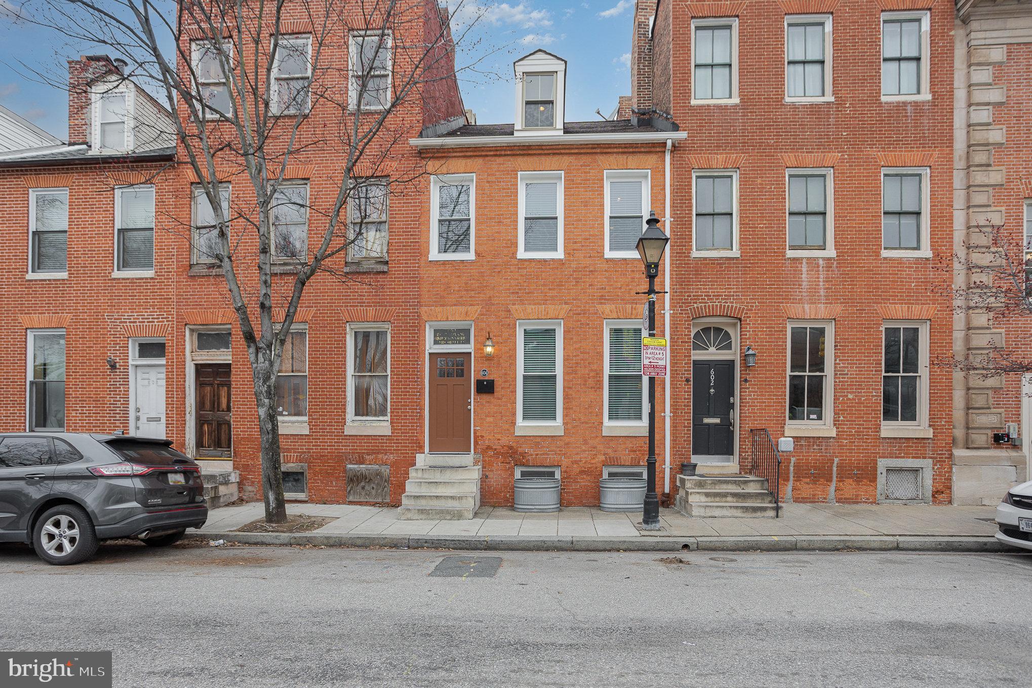 OPEN HOUSE CANCELED DUE TO CONTRACT ACCEPTED! Step into history with this beautifully maintained 2-bedroom 1840 rowhouse, blending original charm with modern updates in an absolutely fabulous location with views of Oriole Park at Camden Yards. Featuring original wood floors, an ornamental fireplace in the dining room, and a spacious living area, this home offers warmth and character throughout. The gorgeous kitchen boasts modern conveniences and recent stainless steel appliances with access to the rear yard.. Relax in the renovated bath, complete with a white vanity and a classic claw-foot soaking tub. There is even a 2nd-floor laundry. The primary bedroom includes a spacious adjacent sitting room, also with a gorgeous ornamental fireplace, while the second bedroom enjoys privacy on the third floor. A finished basement with built-in shelving provides additional flexible space. Recent updates include new windows (2025), central air, appliances (2023) and roof (2023). Enjoy plentiful permit-only parking and direct access to Oriole Park at Camden Yards and all of Downtown Baltimore just across the street! Nearby, you will find the M&T Bank Stadium, the Hippodrome, the MARC train, bus stops, the Inner Harbor, shops, restaurants, hospitals, and many Baltimore businesses.  This home is perfect for baseball and football lovers, lovers of the arts, and city dwellers alike!

Don’t miss this rare opportunity to own a piece of Baltimore’s history! Schedule your showing today.