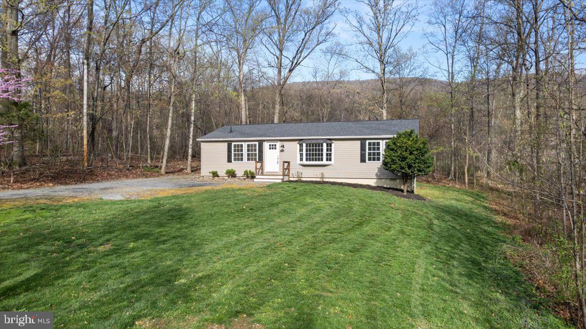 Picturesque setting in Frederick County, minutes to shopping and   Historic downtown Winchester.  This Amazingly spacious 3- bedroom 2 bath home has been extensively remodeled through-out! Large family room, Convenient dining room off from the kitchen, renovated and updated kitchen too! Large primary ensuite with spa-like bath, the additional 2 bedrooms are freshly painted and are good-sized, Full Hall bath, separate laundry area, updated lighting, new flooring and a new roof!   Nothing to do but move in! Don't forget about the shed, it will be a great place to store your lawn and garden tools. The community offers fishing, swimming and playground areas. Xfinity cable is also available here! Call me to schedule your private tour today! Back to Active through NO fault of the seller. No Inspections were performed.
