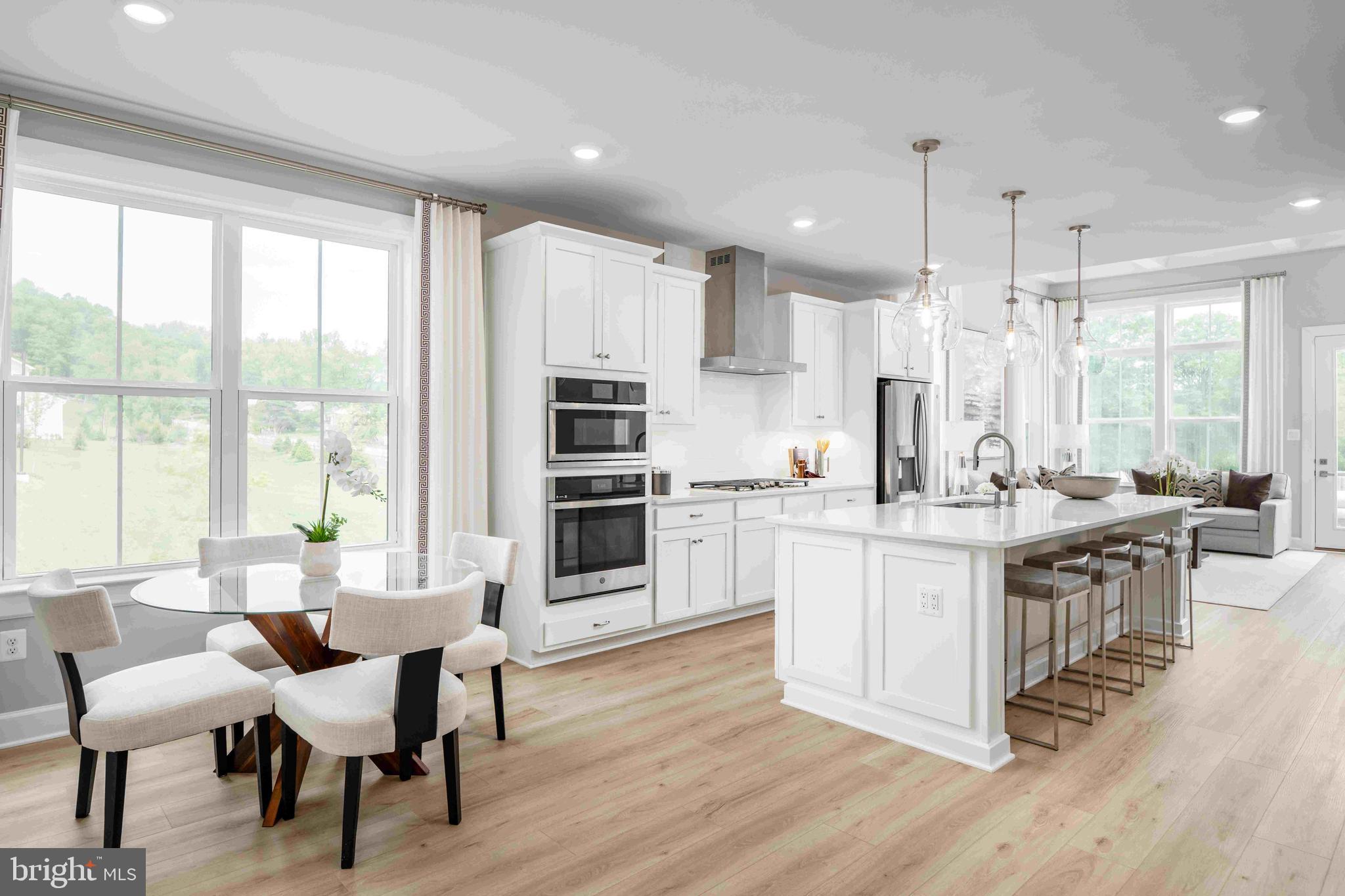 Kerger Pond by NVHomes offers low‑maintenance 55+ living in a private enclave of all end‑unit villas, ideally located in Ellicott City. This thoughtfully designed Kensington home features zero‑step entry, a main‑level owner’s suite with a spa‑inspired bath and walk‑in closet, and included outdoor living. The home also showcases a stunning kitchen, perfect for everyday living and entertaining. The upper level includes a loft, two additional bedrooms, and the option for a second owner’s suite, providing flexible space for guests or extended living. Enjoy the ease of maintenance‑free living in an intimate community setting.